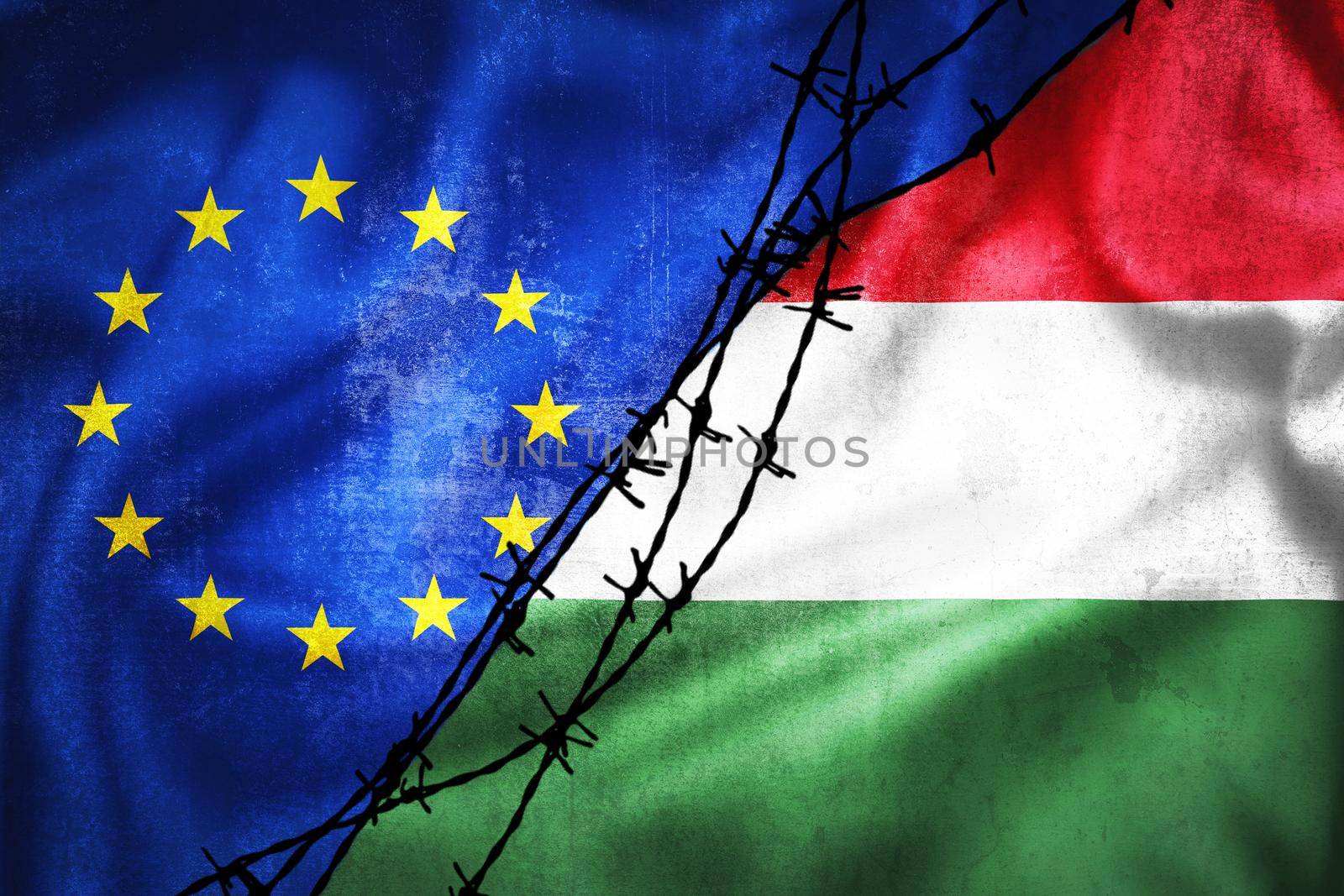 Grunge flags of EU and Hungary divided by barb wire illustration by xbrchx