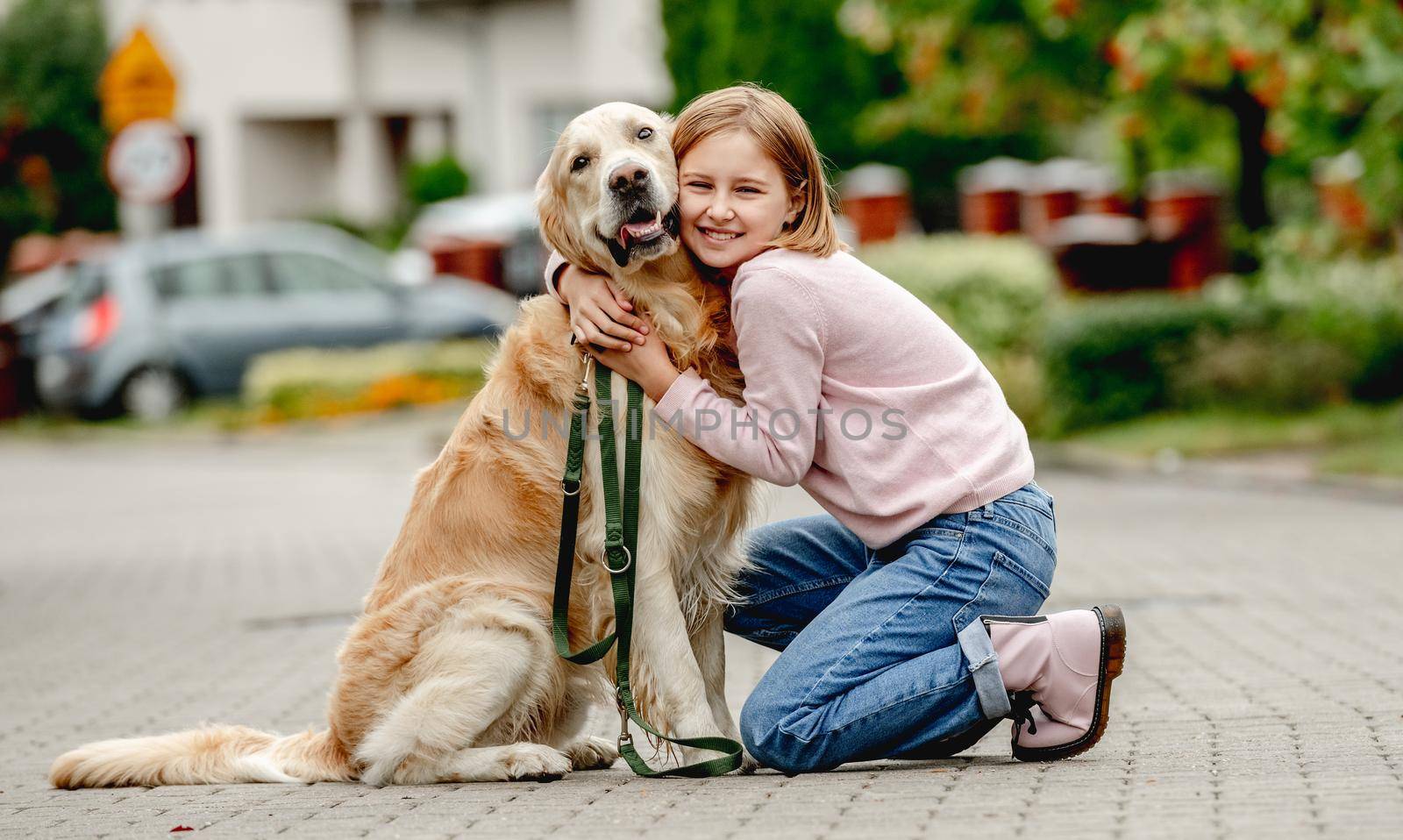 Preteen girl with golden retriever dog by tan4ikk1