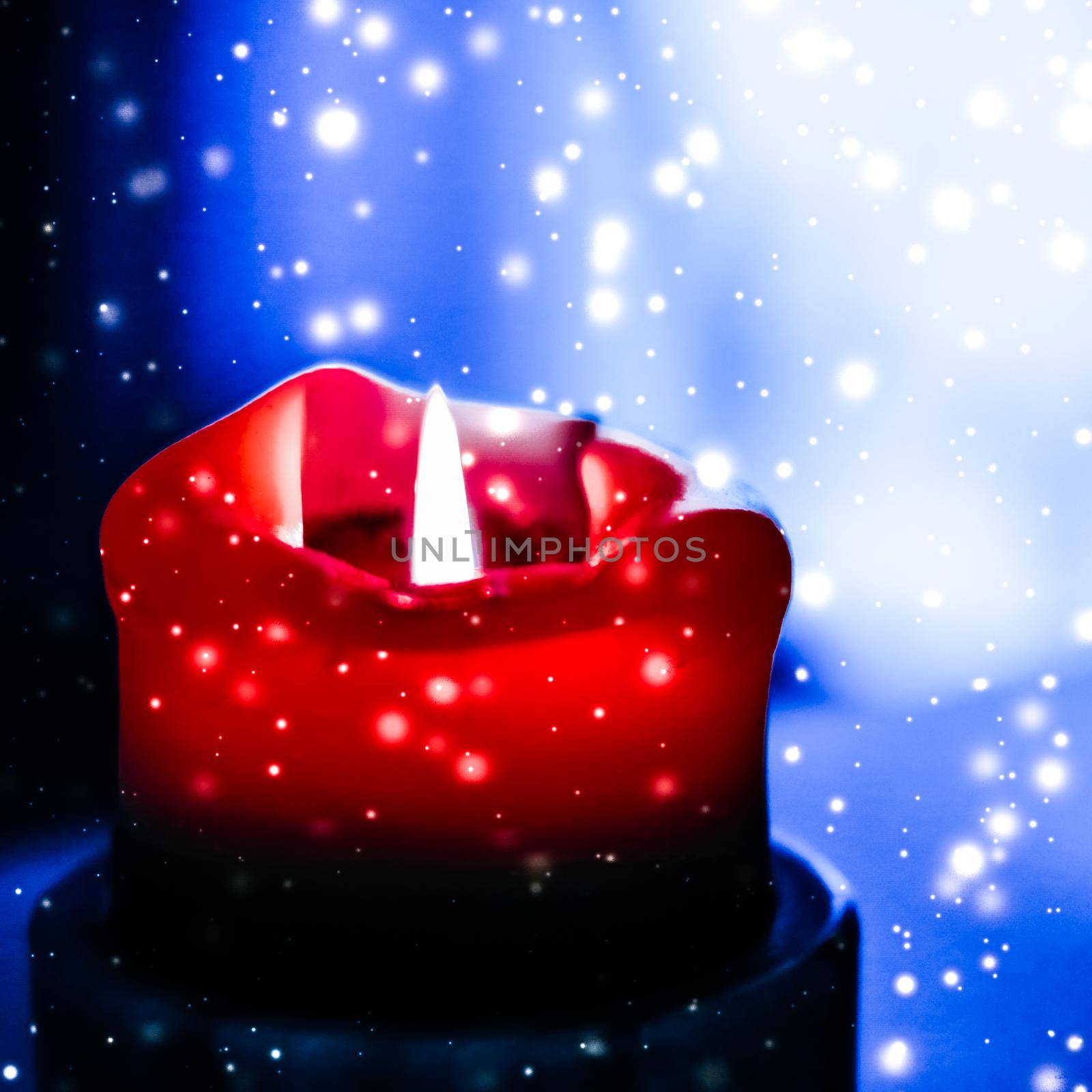 Happy holidays, greeting card and winter season concept - Red holiday candle on blue sparkling snowing background, luxury branding design for Christmas, New Years Eve and Valentines Day