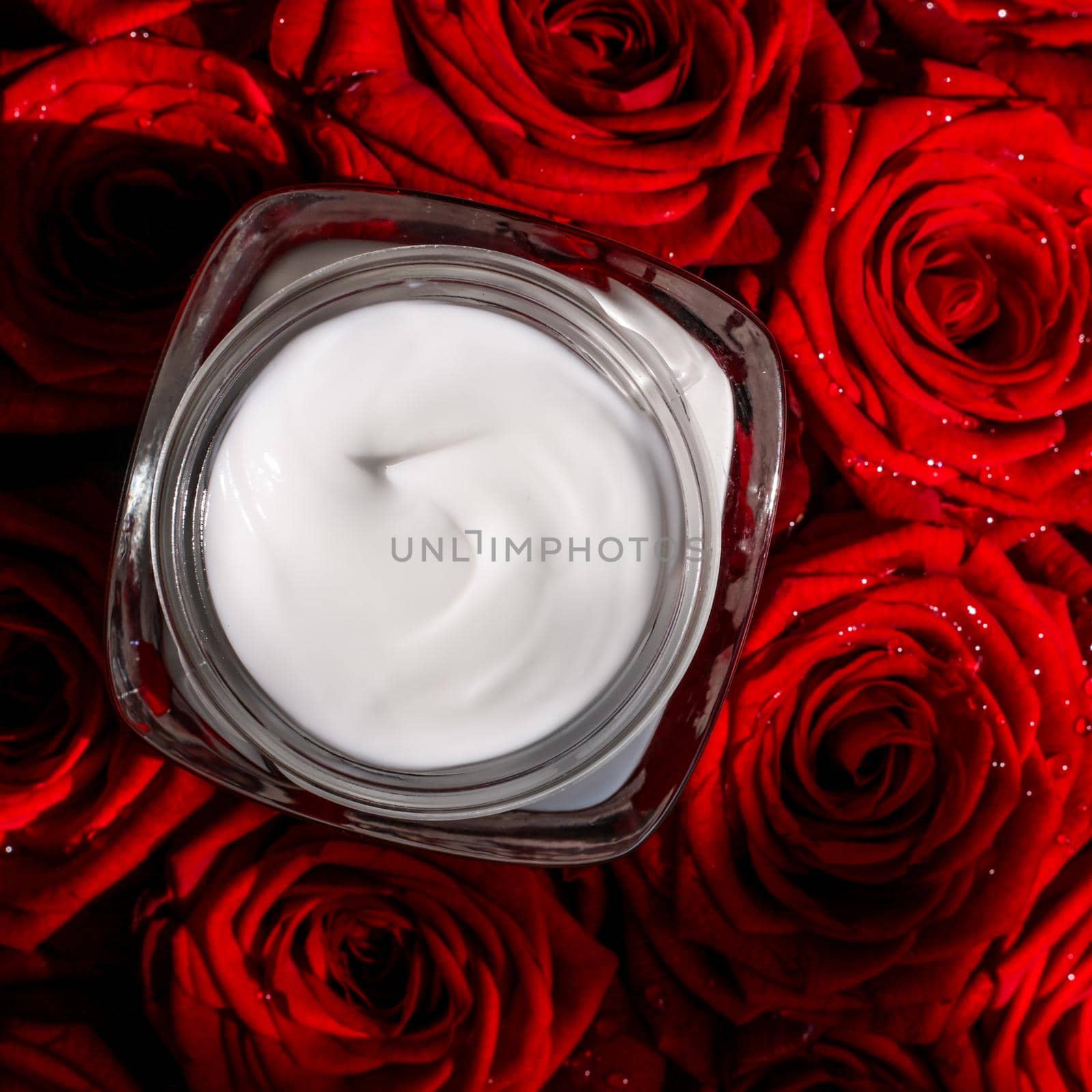 Anti-age moisturizer, luxe cosmetics and organic science concept - Moisturizing beauty face cream for sensitive skin and red roses flowers, luxury clean skincare cosmetics on floral background