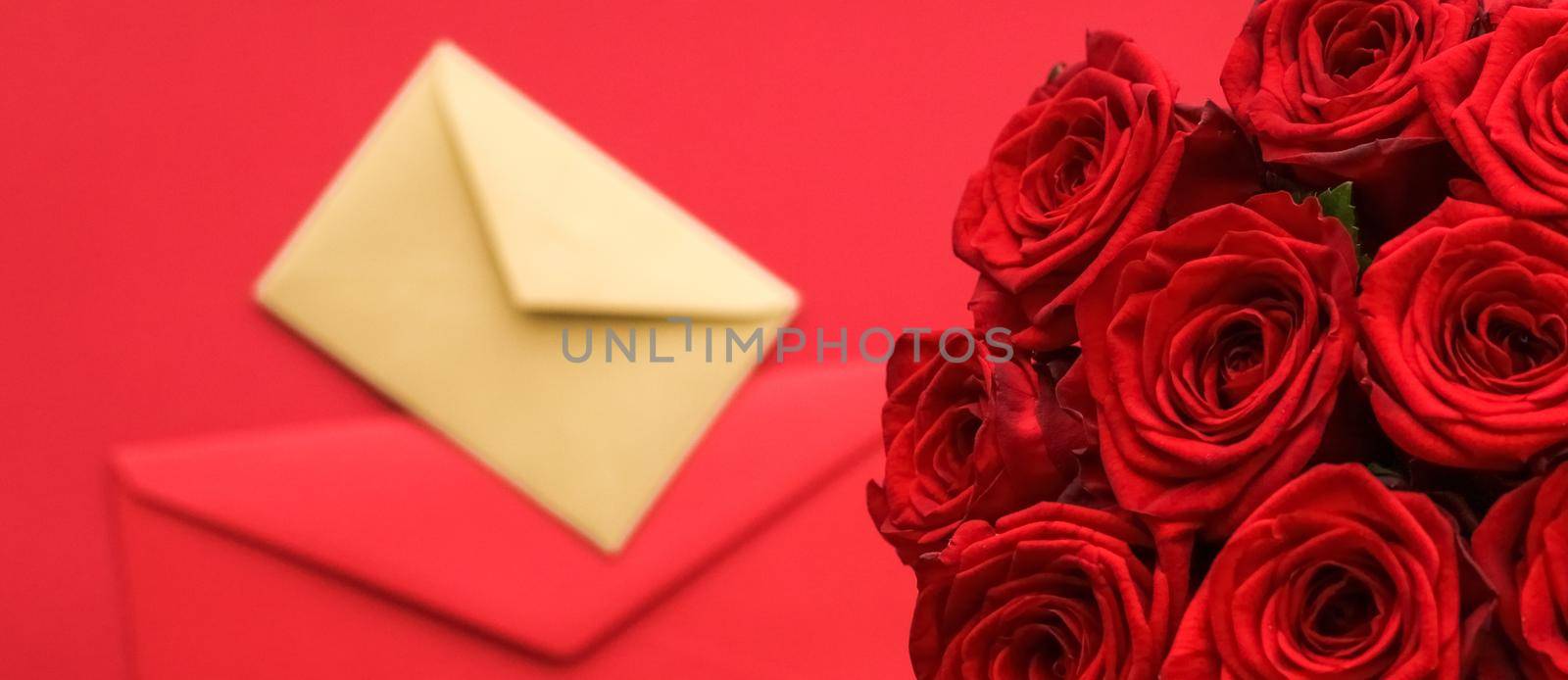 Holiday gift, flowers flatlay and happy relationship concept - Love letter and flower delivery service on Valentines Day, luxury bouquet of red roses and card envelopes on red background