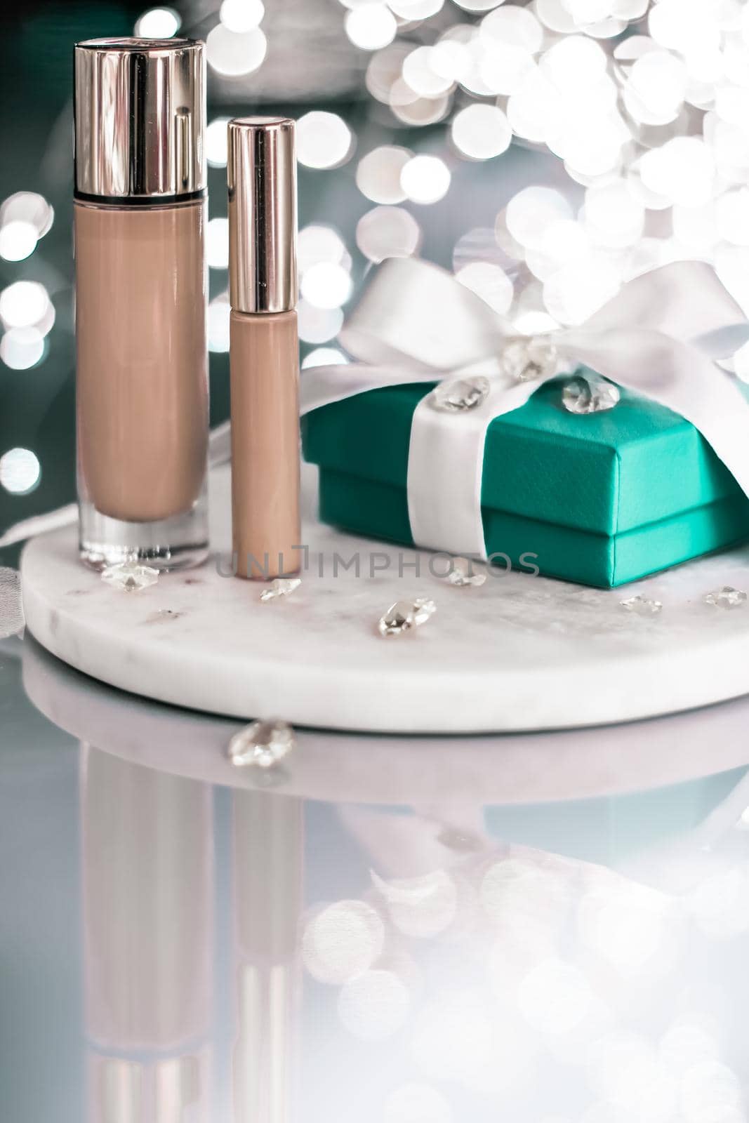 Cosmetic branding, Christmas glitter and girly blog concept - Holiday make-up foundation base, concealer and green gift box, luxury cosmetics present and blank label products for beauty brand design