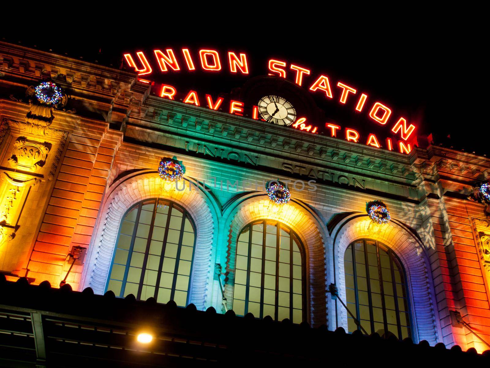 Union Station decorated with light for Christmas.