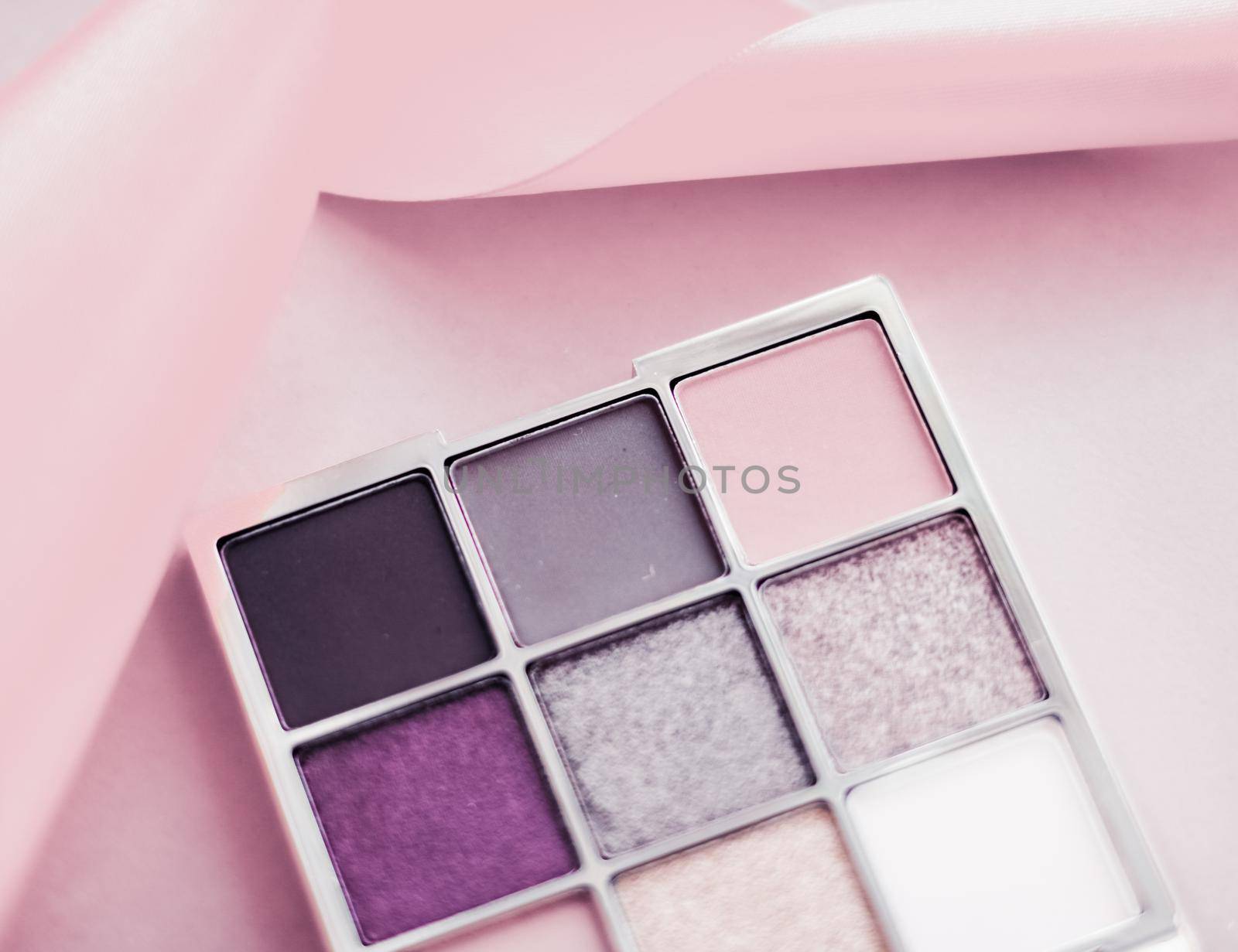 Eyeshadow palette and make-up brush on blush pink background, eye shadows cosmetics product as luxury beauty brand promotion and holiday fashion blog design by Anneleven