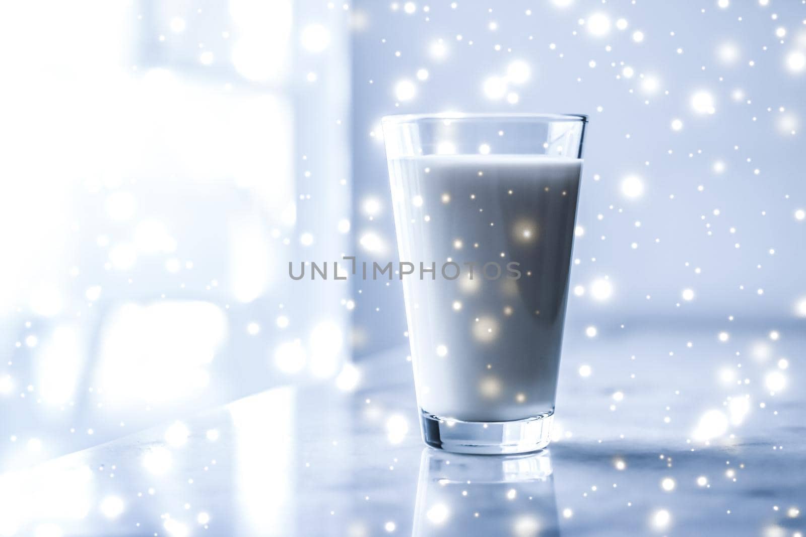 Dairy products, healthy diet and Christmas food concept - Magic holiday drink, pouring organic lactose free milk into glass on marble table