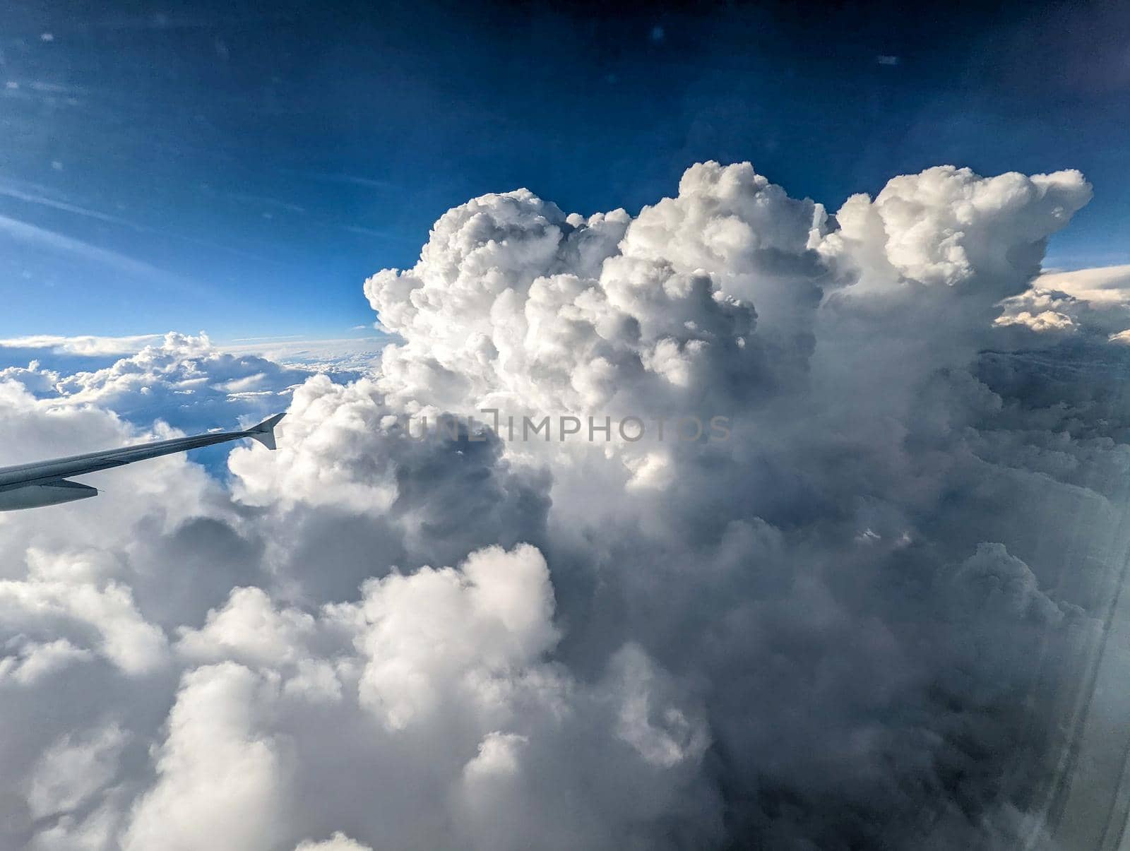 flying high in the sky with beautiful clouds