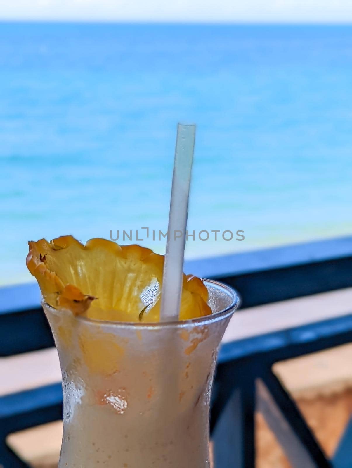 enjoying a dringk and a view of beach in oahu hawaii by digidreamgrafix