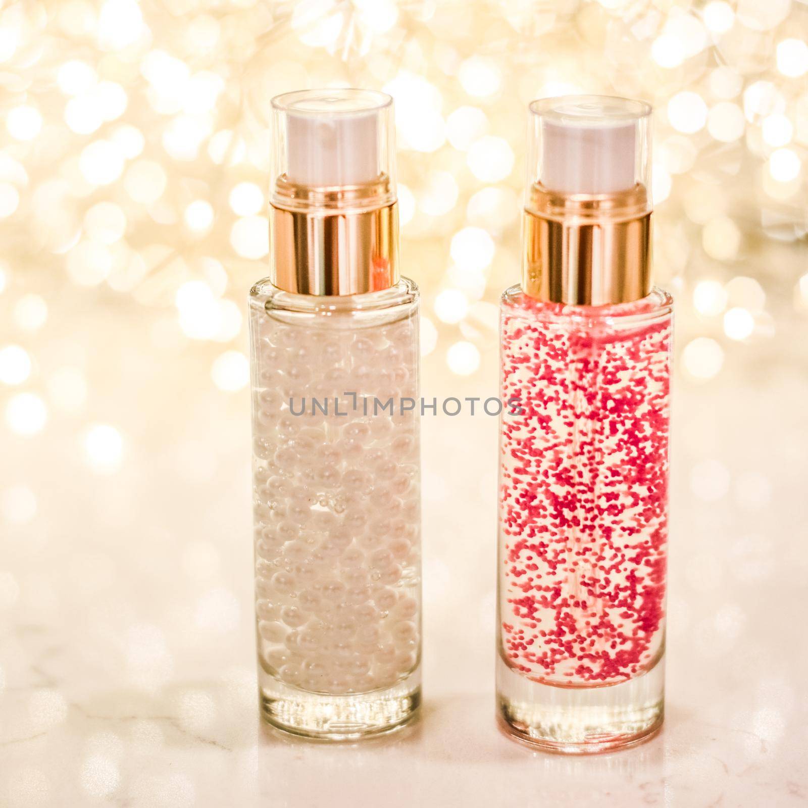 Cosmetic branding, blank label and glamour present concept - Holiday make-up base gel, serum emulsion, lotion bottle and golden glitter, luxury skin and body care cosmetics for beauty brand ads