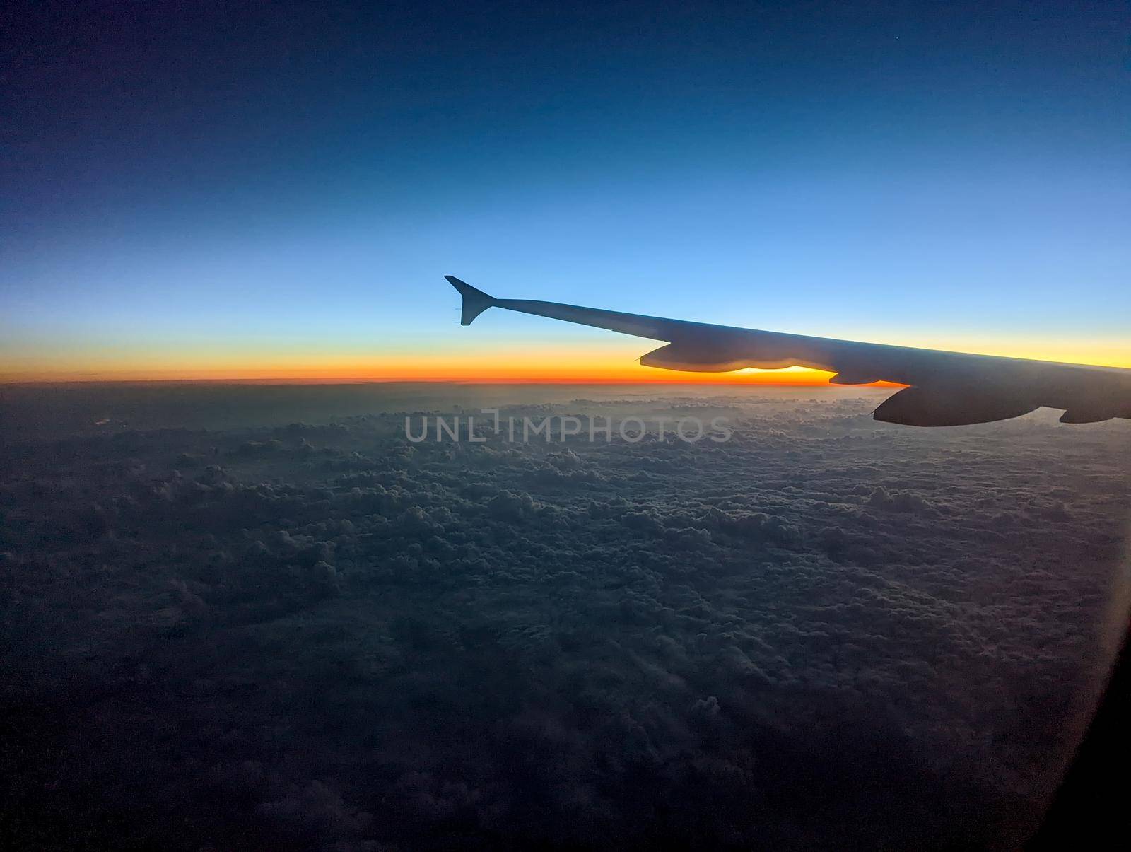 early morning sunrise from an airplane by digidreamgrafix