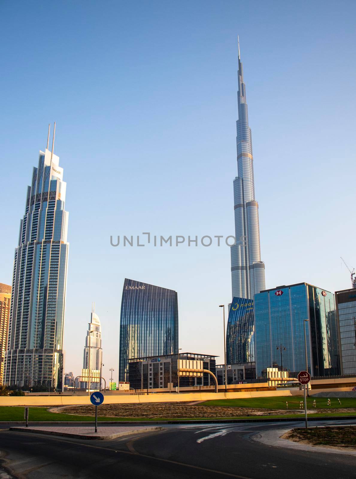 Dubai Financial Center road. Burj Khalifa tallest building in the world can be seen on the scene. Outdoors