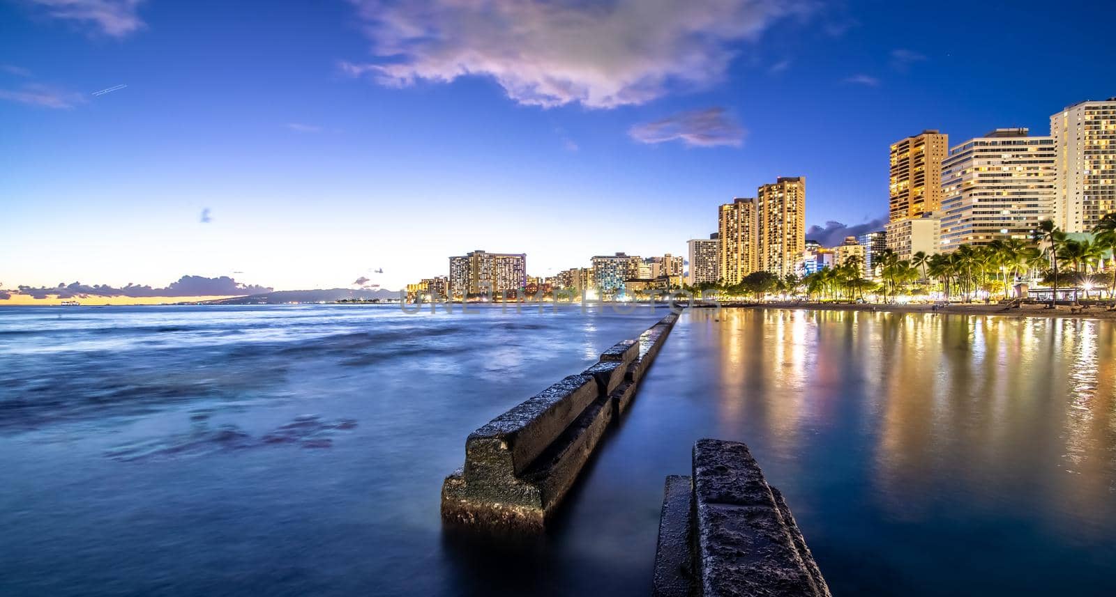 sunset at waikiki beach area in oahu hawaii