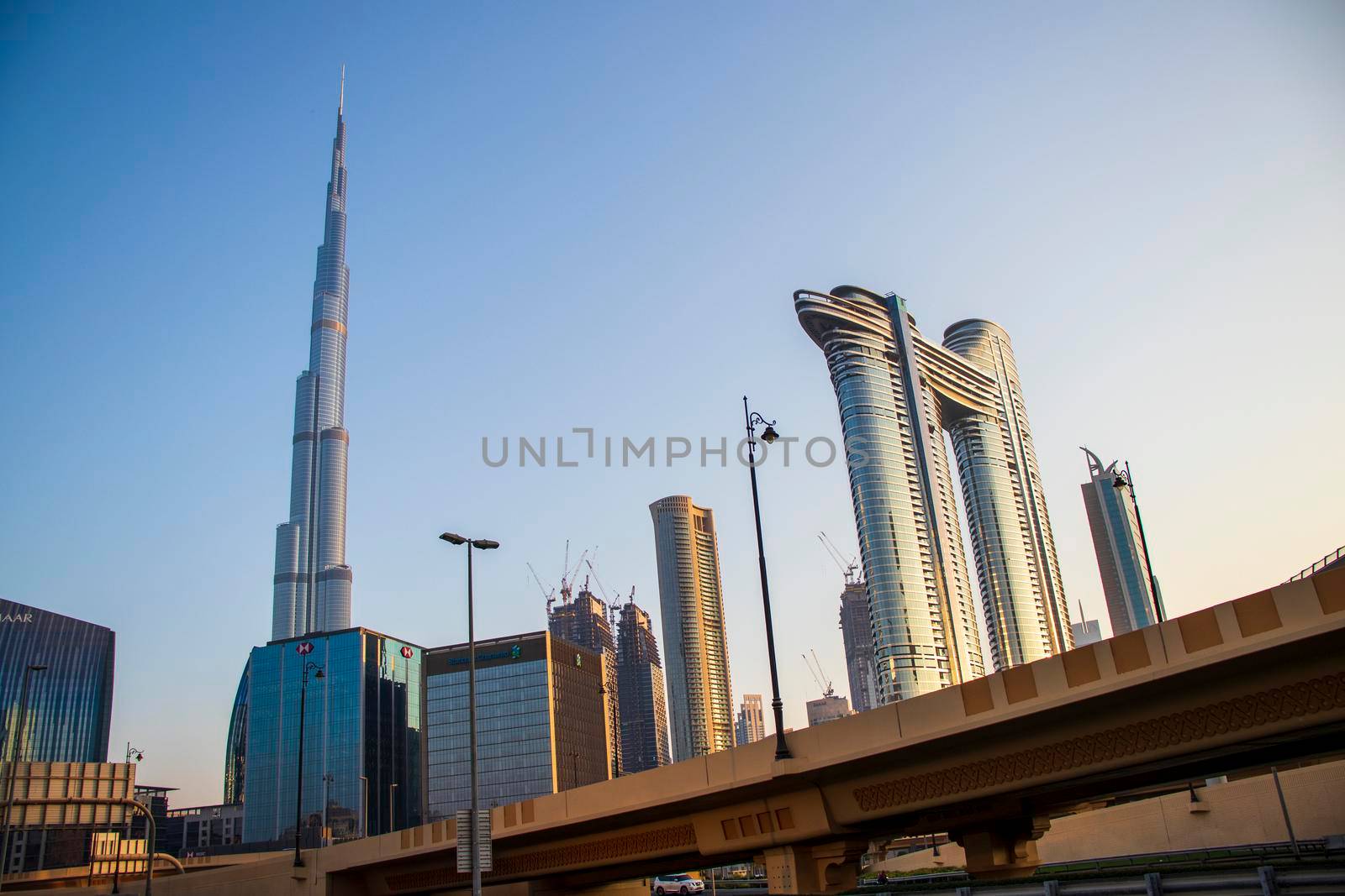Dubai Financial Center road. Address Sky view hotel and Burj Khalifa tallest building in the world can be seen on the scene. Outdoors