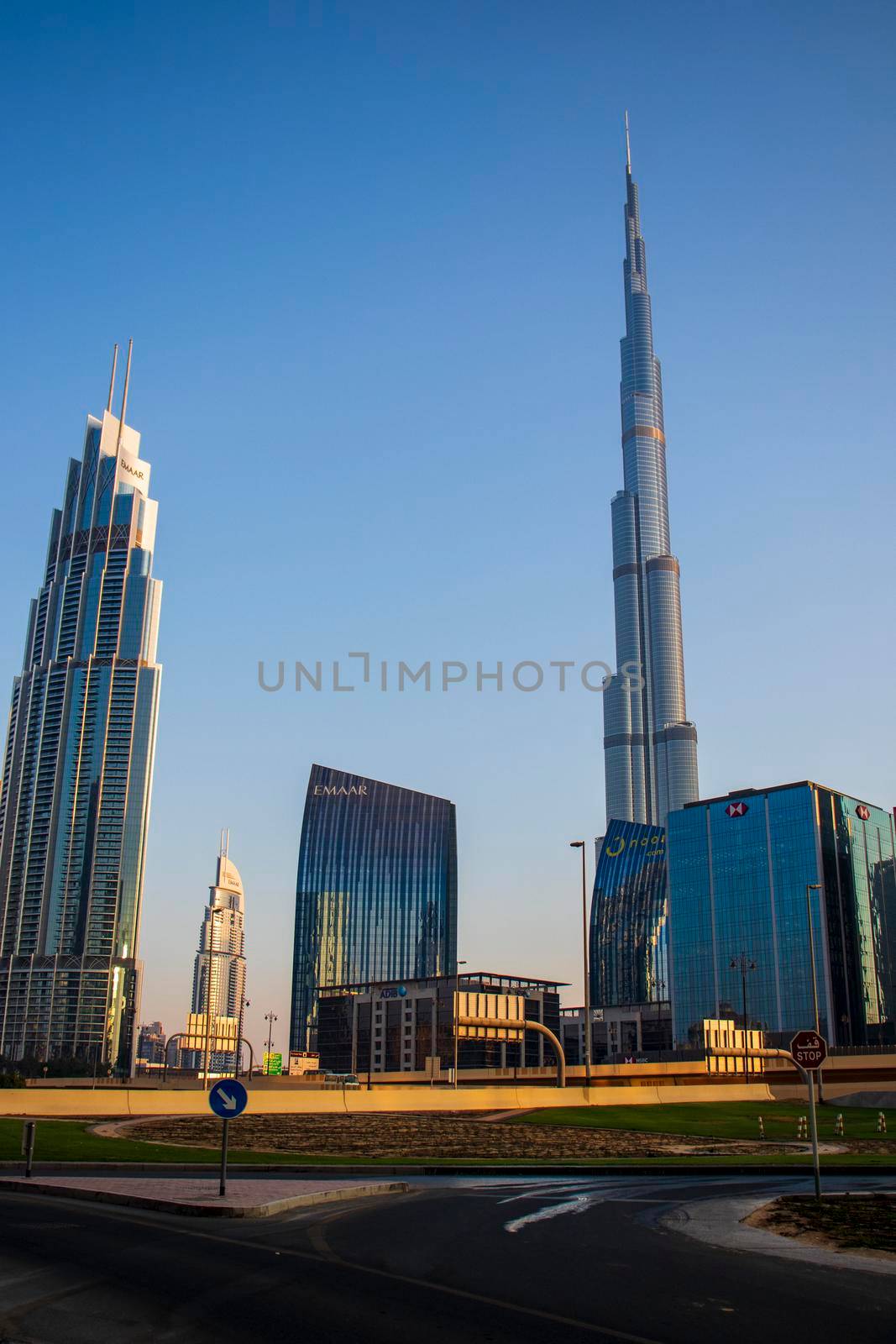 Dubai Financial Center road. Burj Khalifa tallest building in the world can be seen on the scene. Outdoors