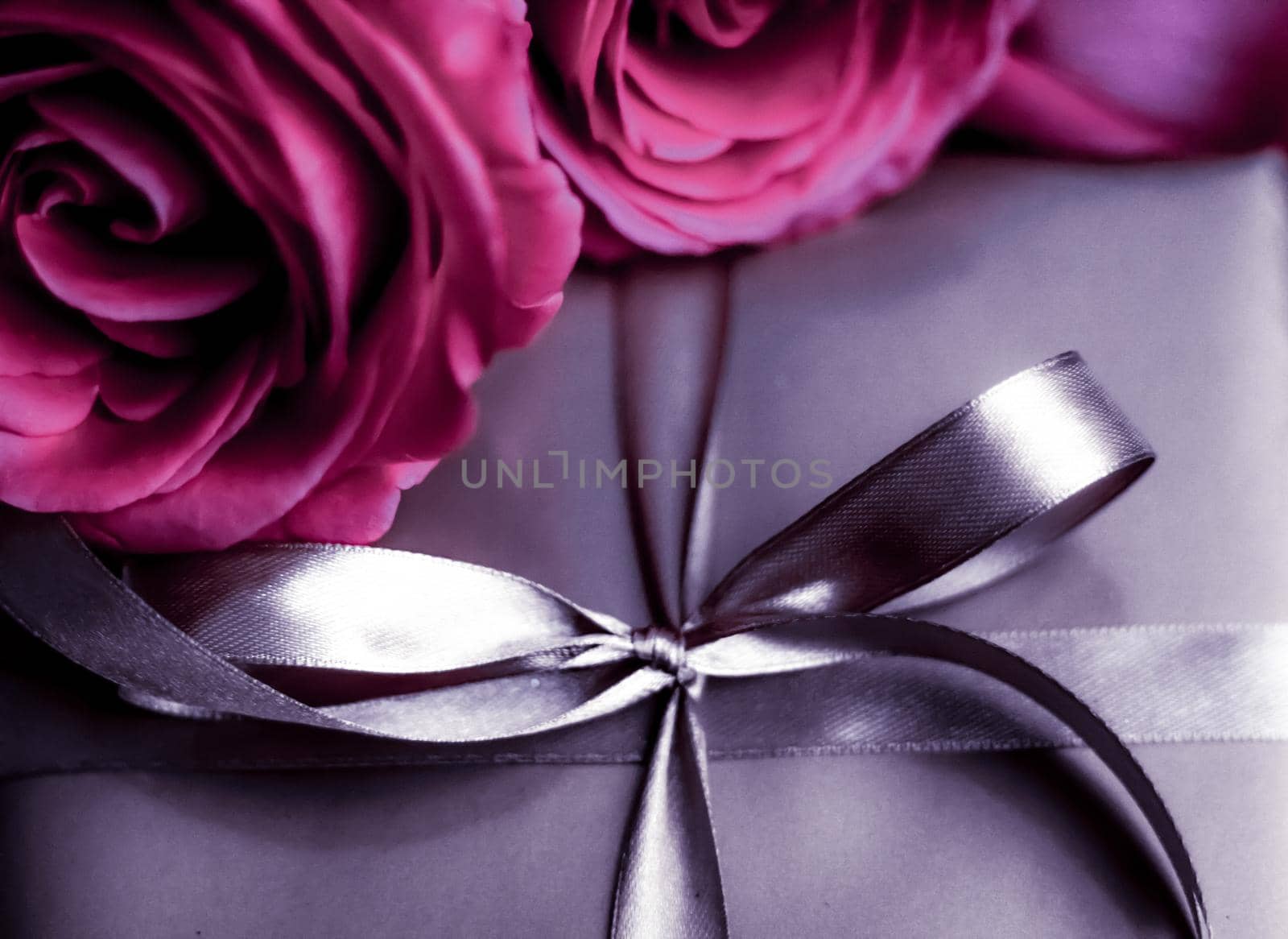 Luxurious design, shop sale promotion and happy surprise concept - Luxury holiday silver gift box and pink roses as Christmas, Valentines Day or birthday present