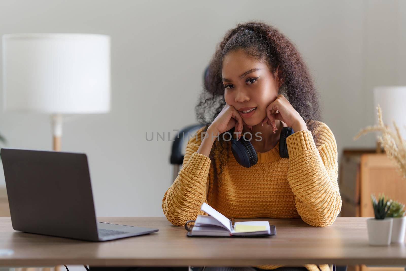 Beautiful woman using laptop working at home. lifestyle concept by itchaznong