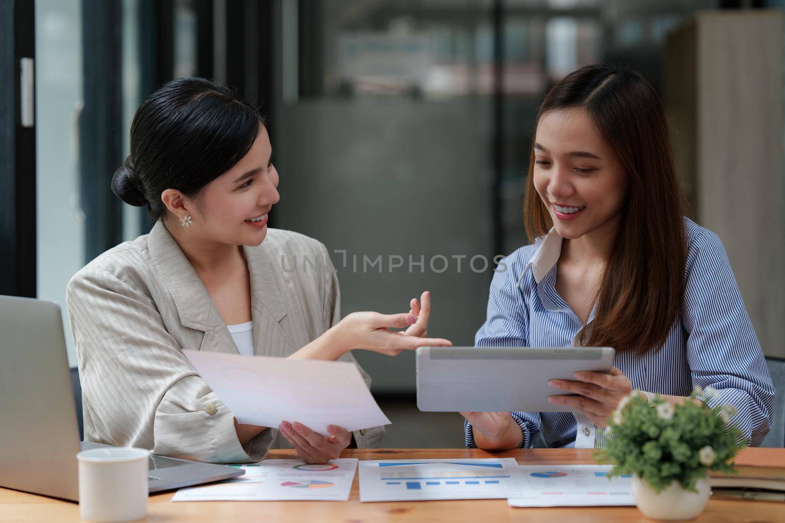 Financial Analyst discussing with Investment Banker at Meeting Room. Fund investment concept.