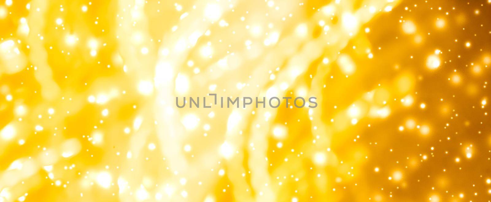 Golden Christmas lights, New Years Eve fireworks and abstract texture concept - Glamorous gold shiny glow and glitter, luxury holiday background