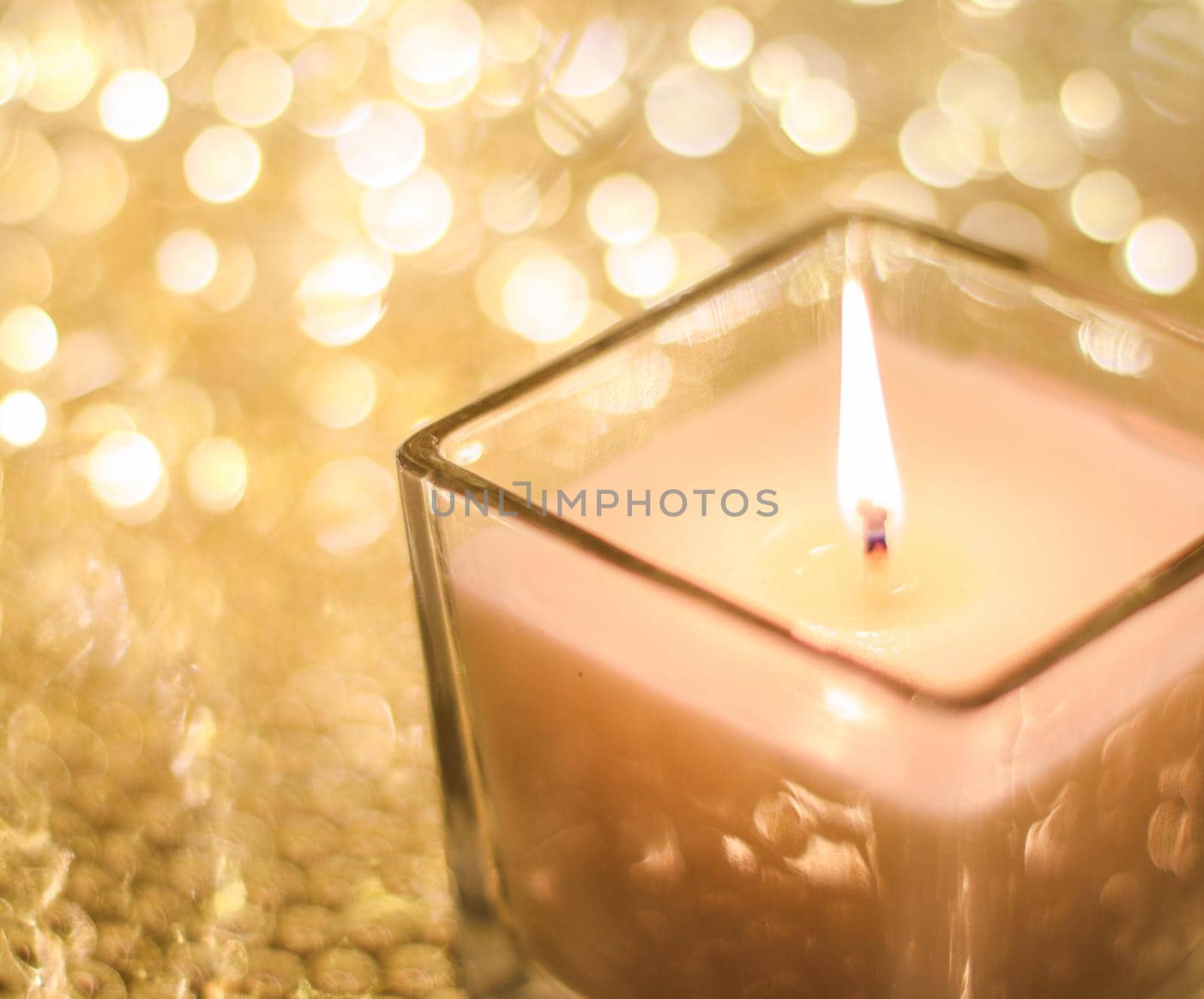 Aromatic candle on golden Christmas and New Years glitter background, Valentines Day luxury home decor and holiday season brand design by Anneleven