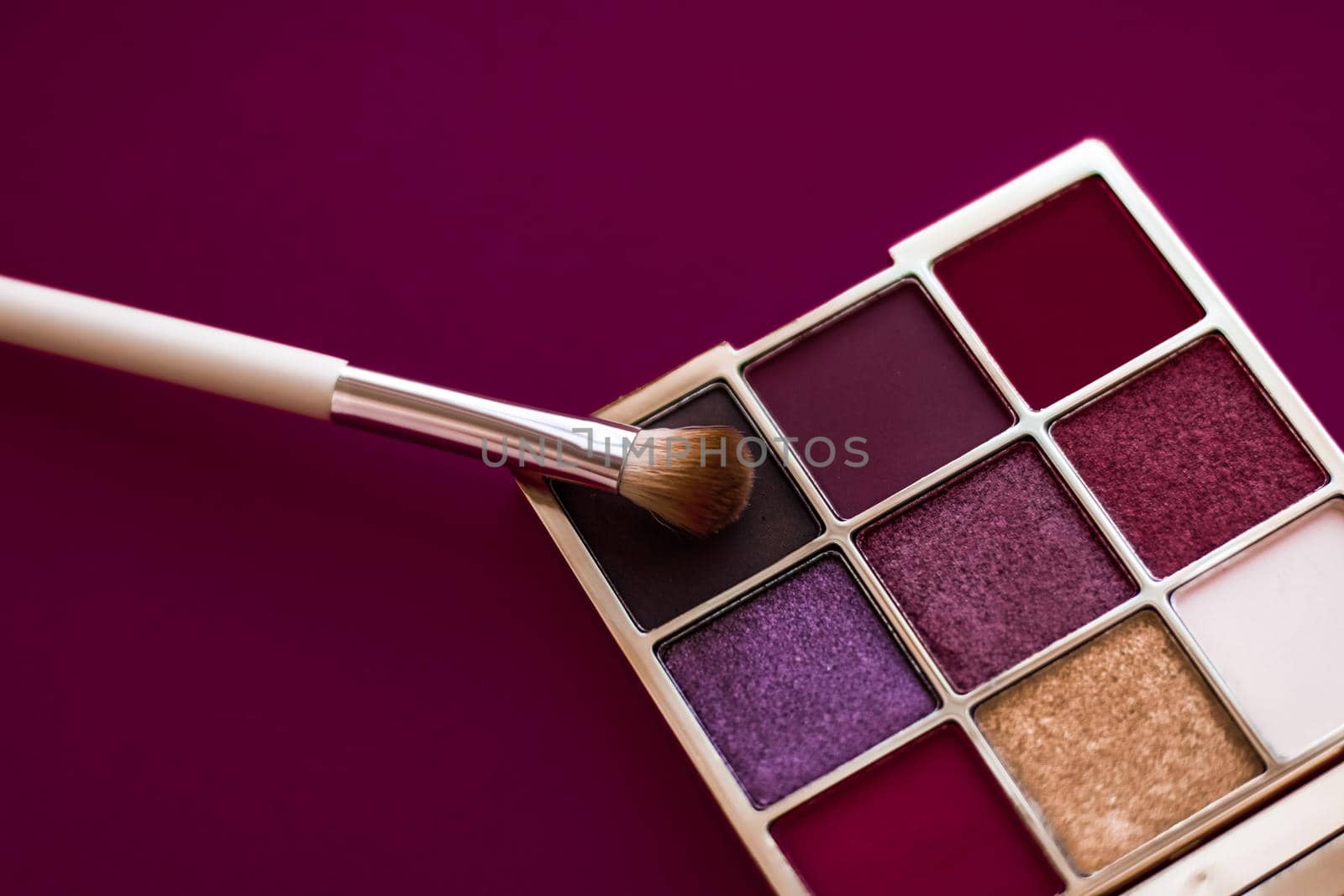 Eyeshadow palette and make-up brush on wine background, eye shadows cosmetics product for luxury beauty brand promotion and holiday fashion blog design by Anneleven