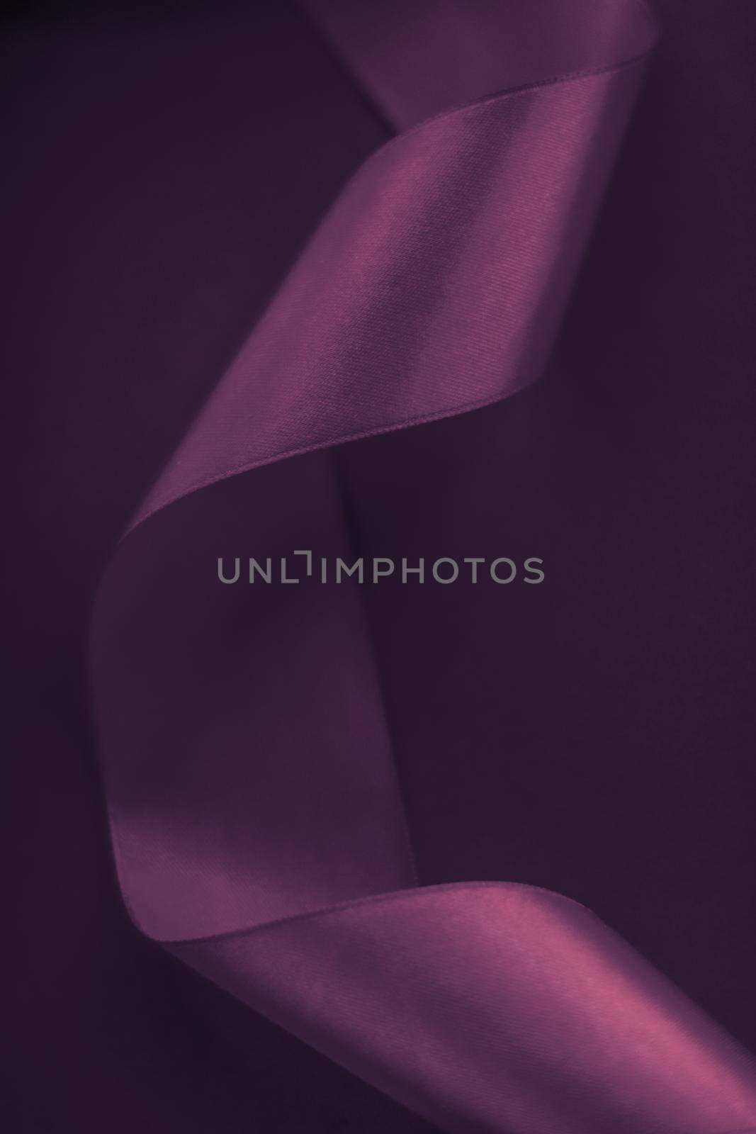 Branding, holidays and luxe brands concept - Abstract curly silk ribbon on purple background, exclusive luxury brand design for holiday sale product promotion and glamour art invitation card backdrop