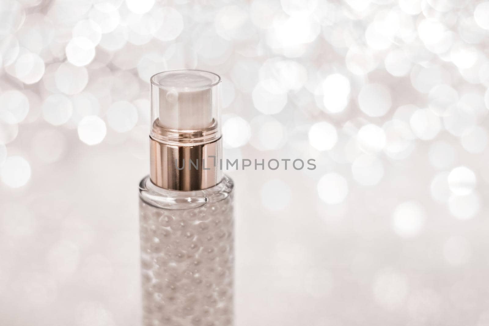 Cosmetic branding, blank label and glamour present concept - Holiday make-up base gel, serum emulsion, lotion bottle and silver glitter, luxury skin and body care cosmetics for beauty brand ads