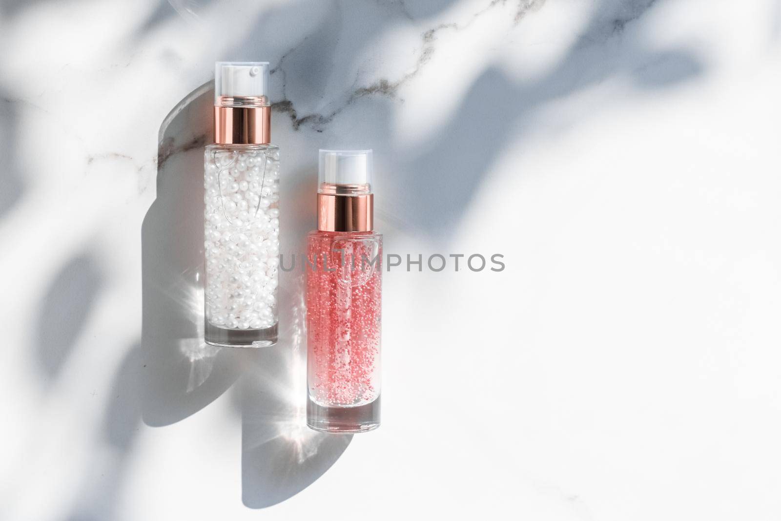 Cosmetic branding, packaging and make-up concept - Skin care serum and gel bottle, moisturizing lotion and lifting cream emulsion on marble, anti-age cosmetics for luxury beauty skincare brand design