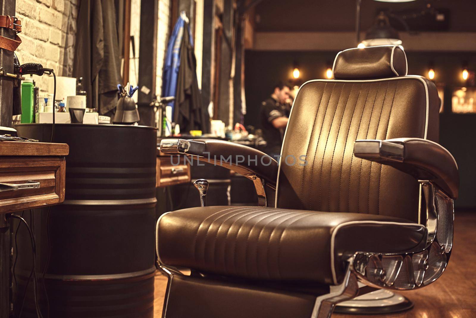 Brown leather chair in barbershop. Loft style by nazarovsergey