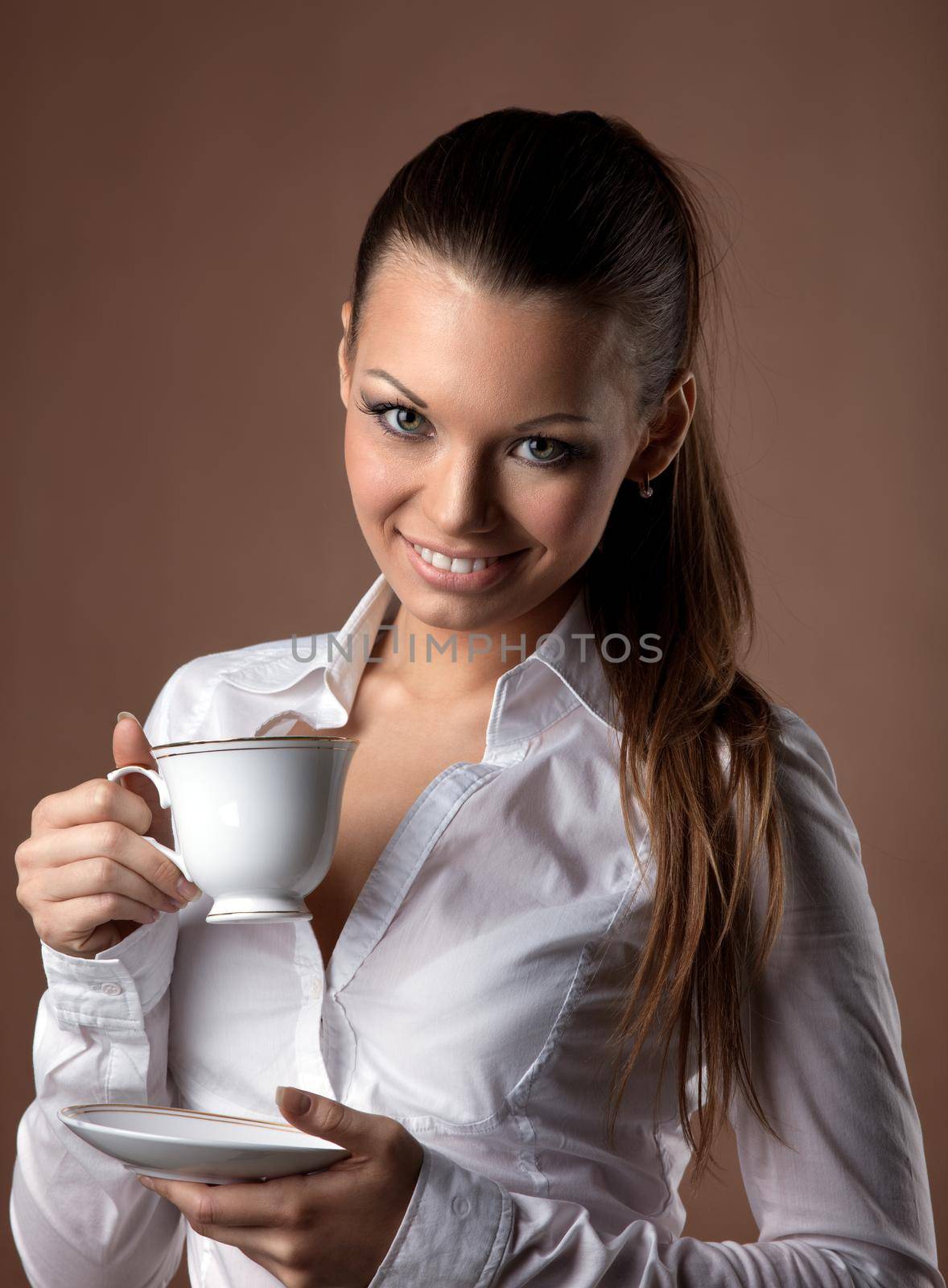 beauty woman with cup of coffee smile at brown background