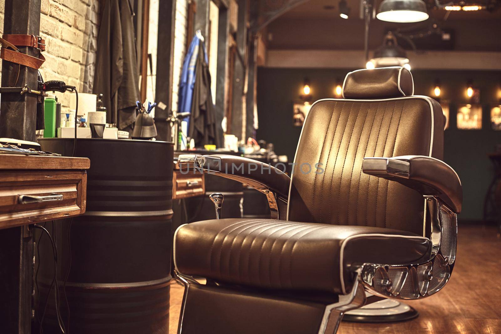 Close up brown leather chair in barbershop. Loft style