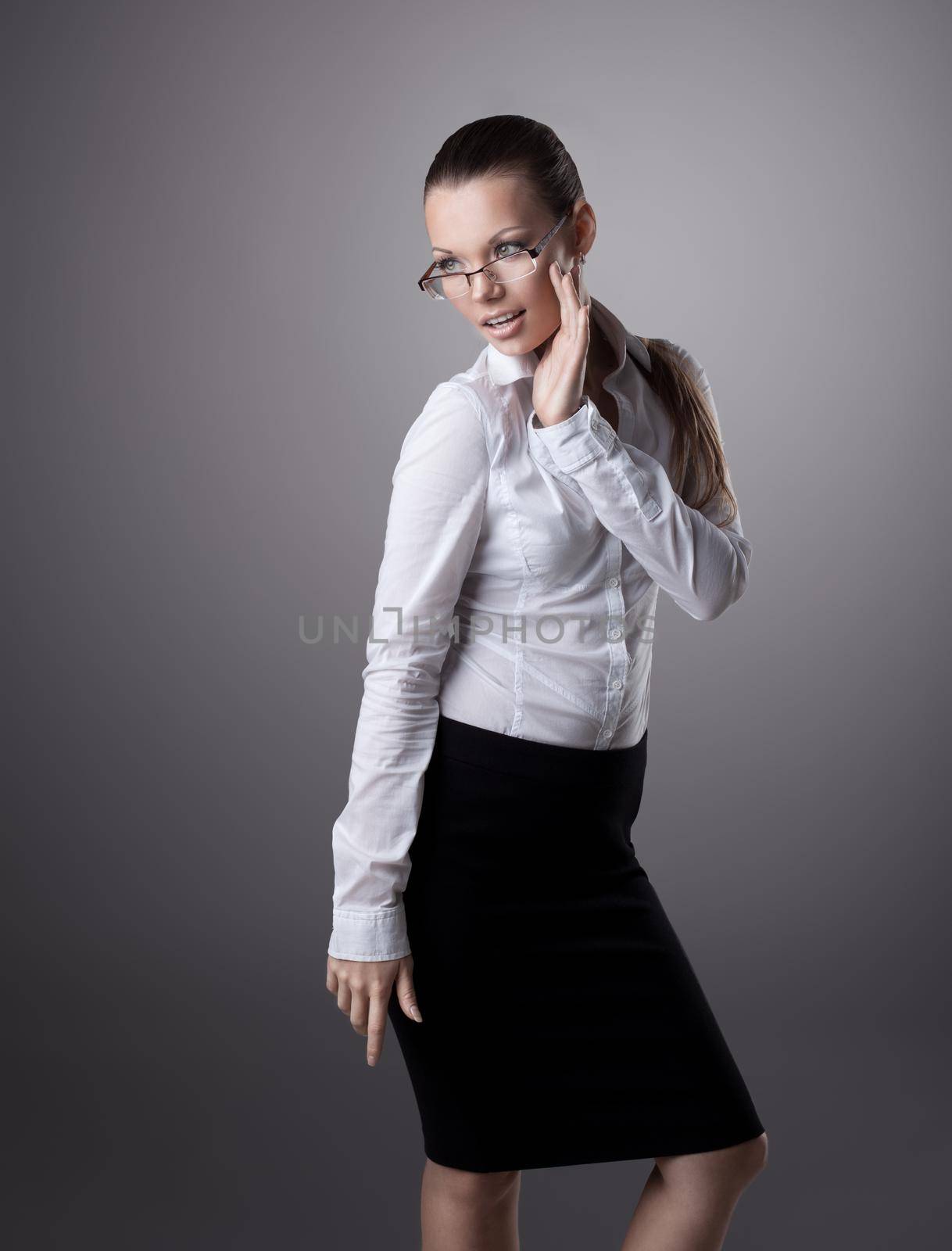 Sexy young business woman in glasses look at light