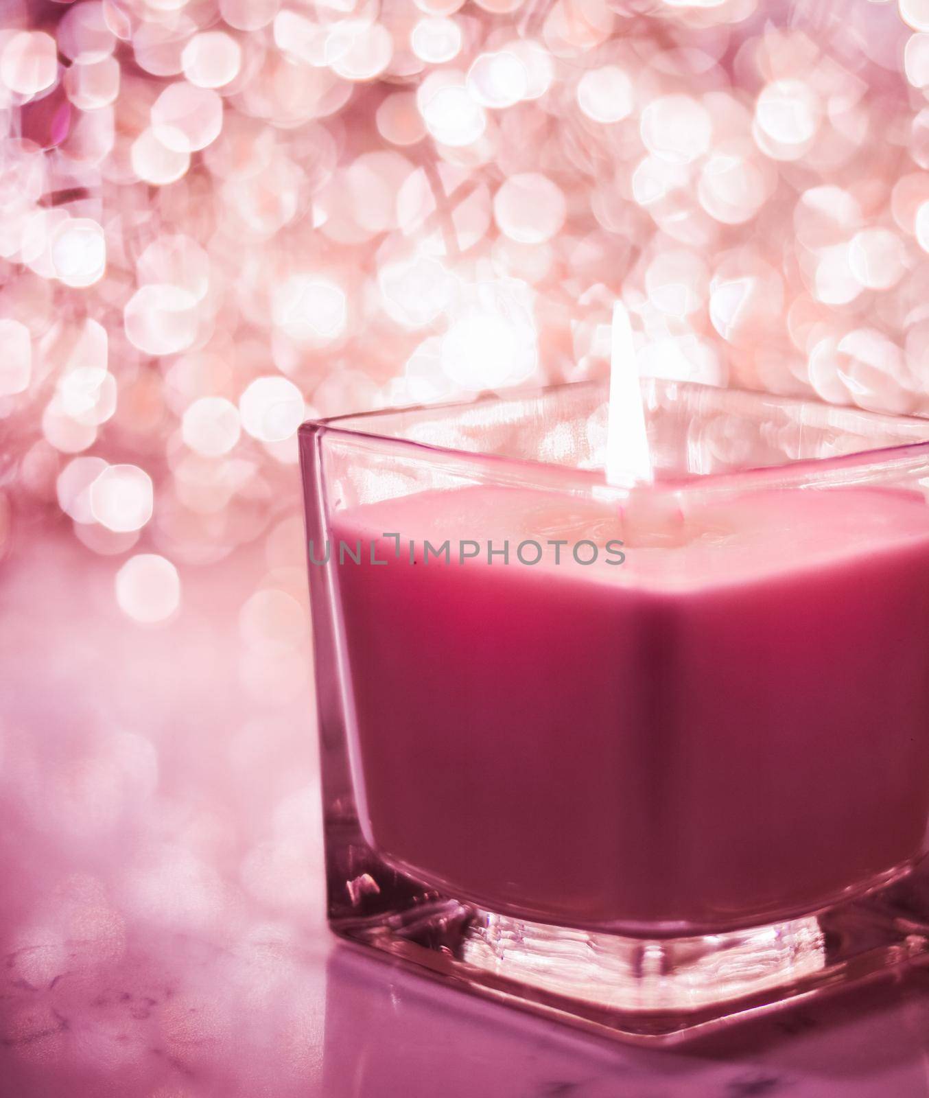 Festive decoration, branding and aromatherapy spa concept - Red aromatic candle on Christmas and New Years glitter background, Valentines Day luxury home decor and holiday season brand design