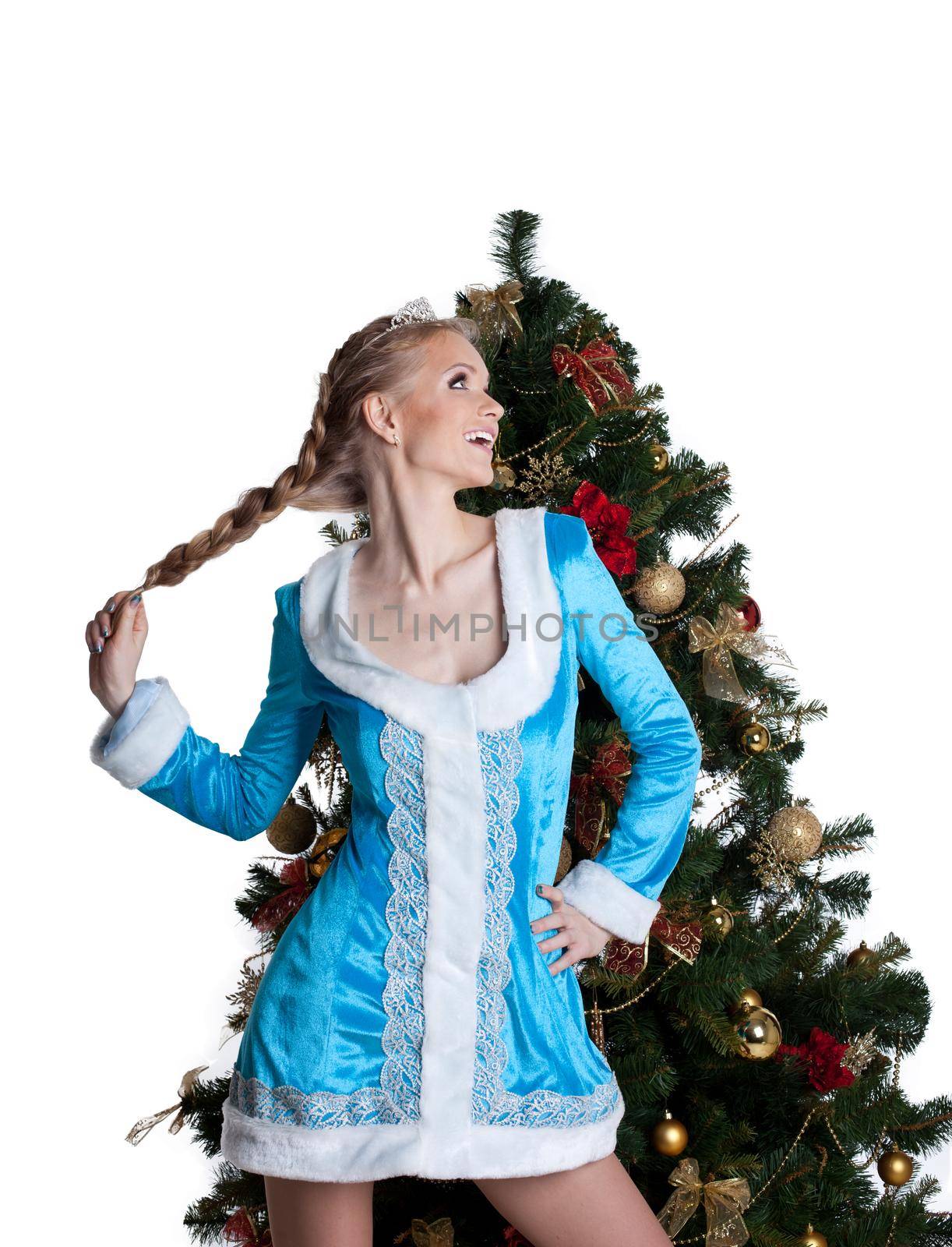 Sexy christmas girl portrait with new year fir tree - look at light