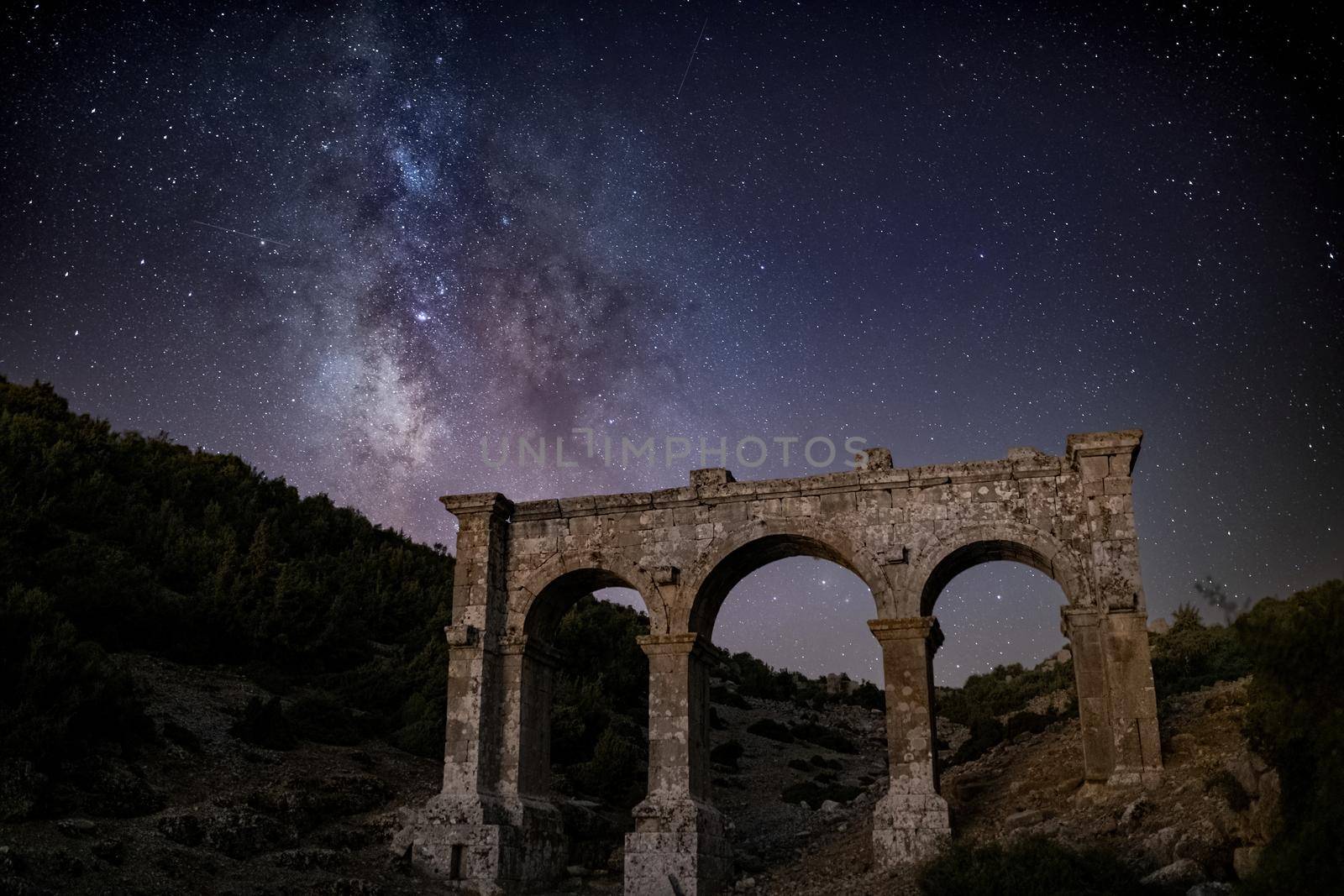 The ancient city of Ariassos, the city gate in a night when the Milky Way is visible by Sonat