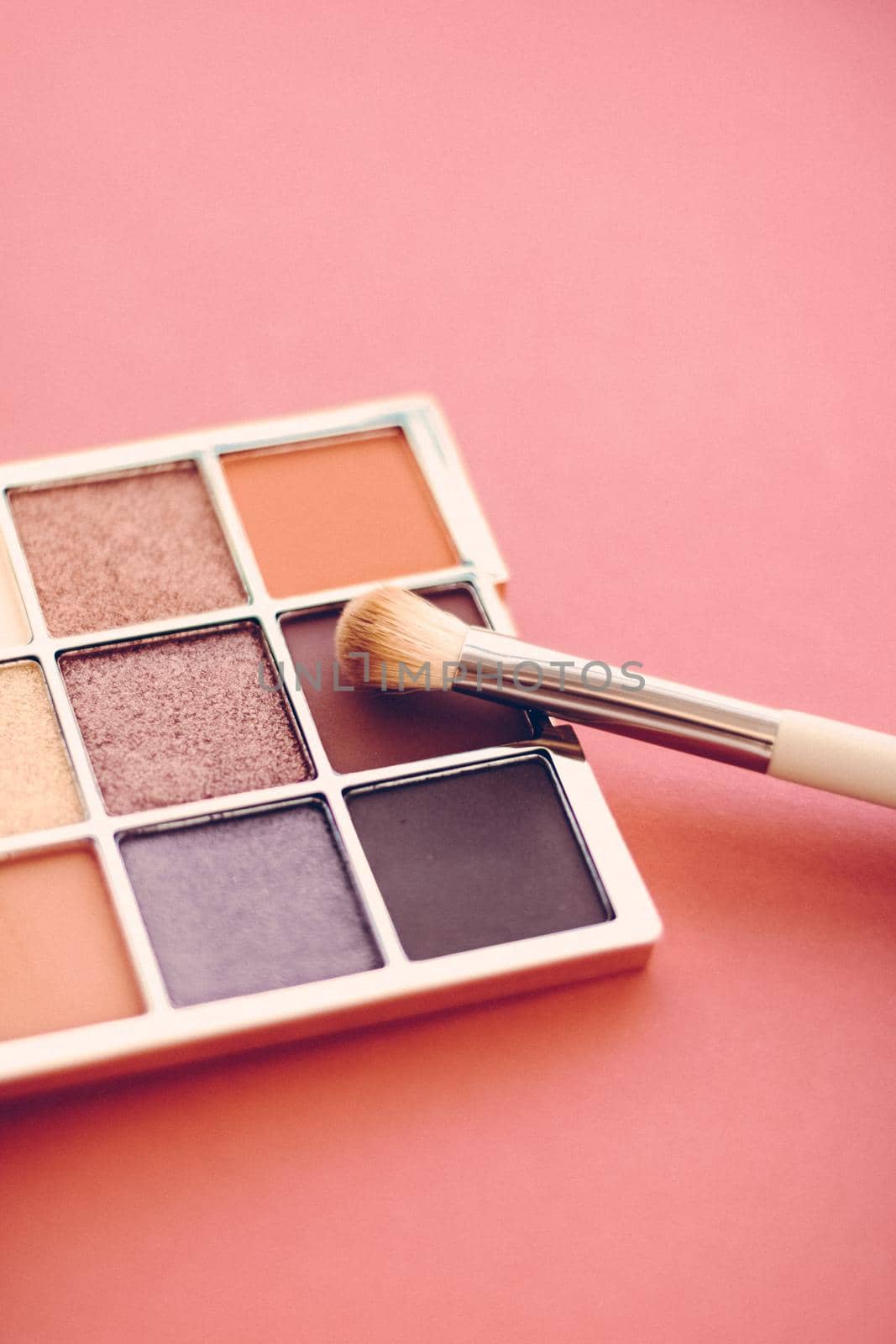 Eyeshadow palette and make-up brush on orange background, eye shadows cosmetics product as luxury beauty brand promotion and holiday fashion blog design by Anneleven