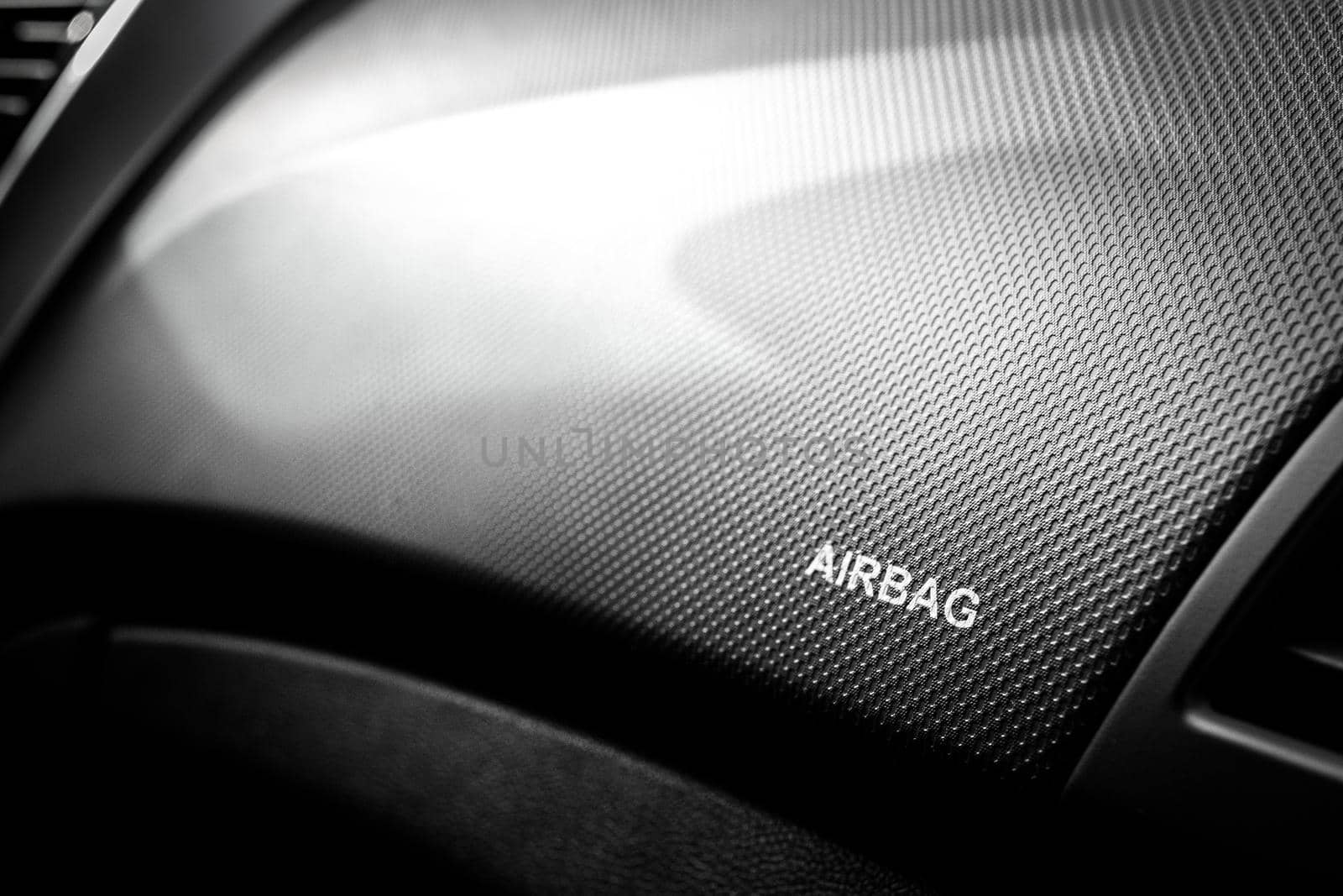 The inscription airbag in the cabin on the front panel of the car above the glove compartment.