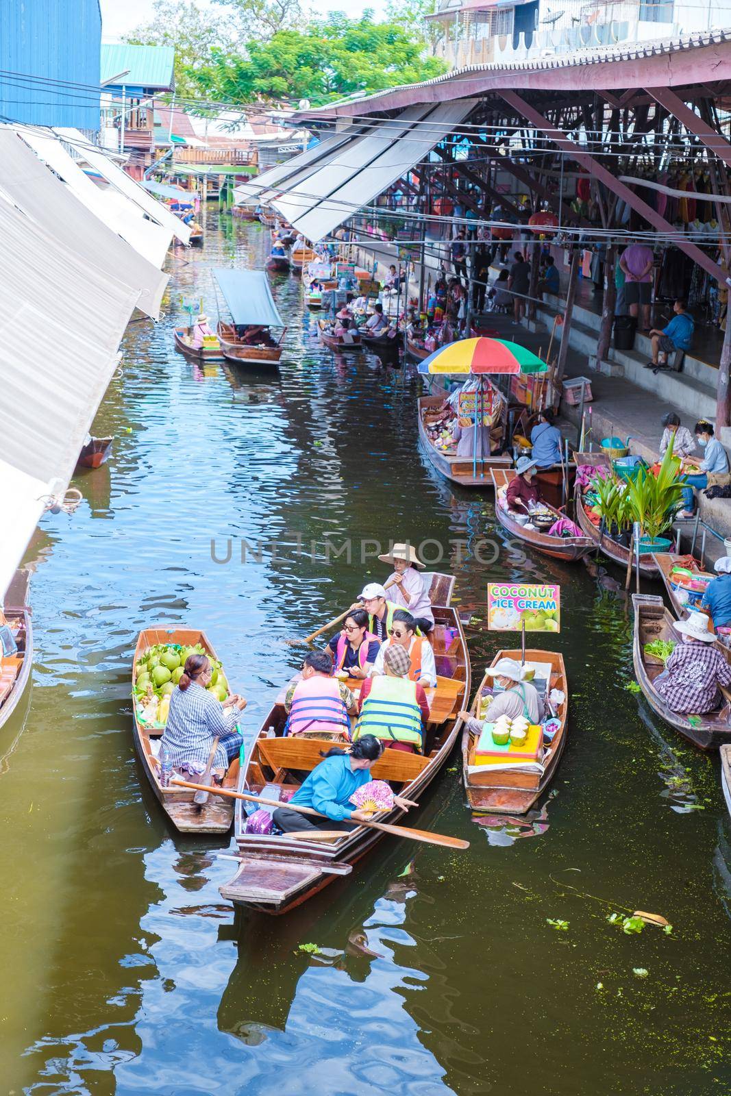 People at Damnoen saduak floating market, Bangkok Thailand. colorful floating market in Thailand