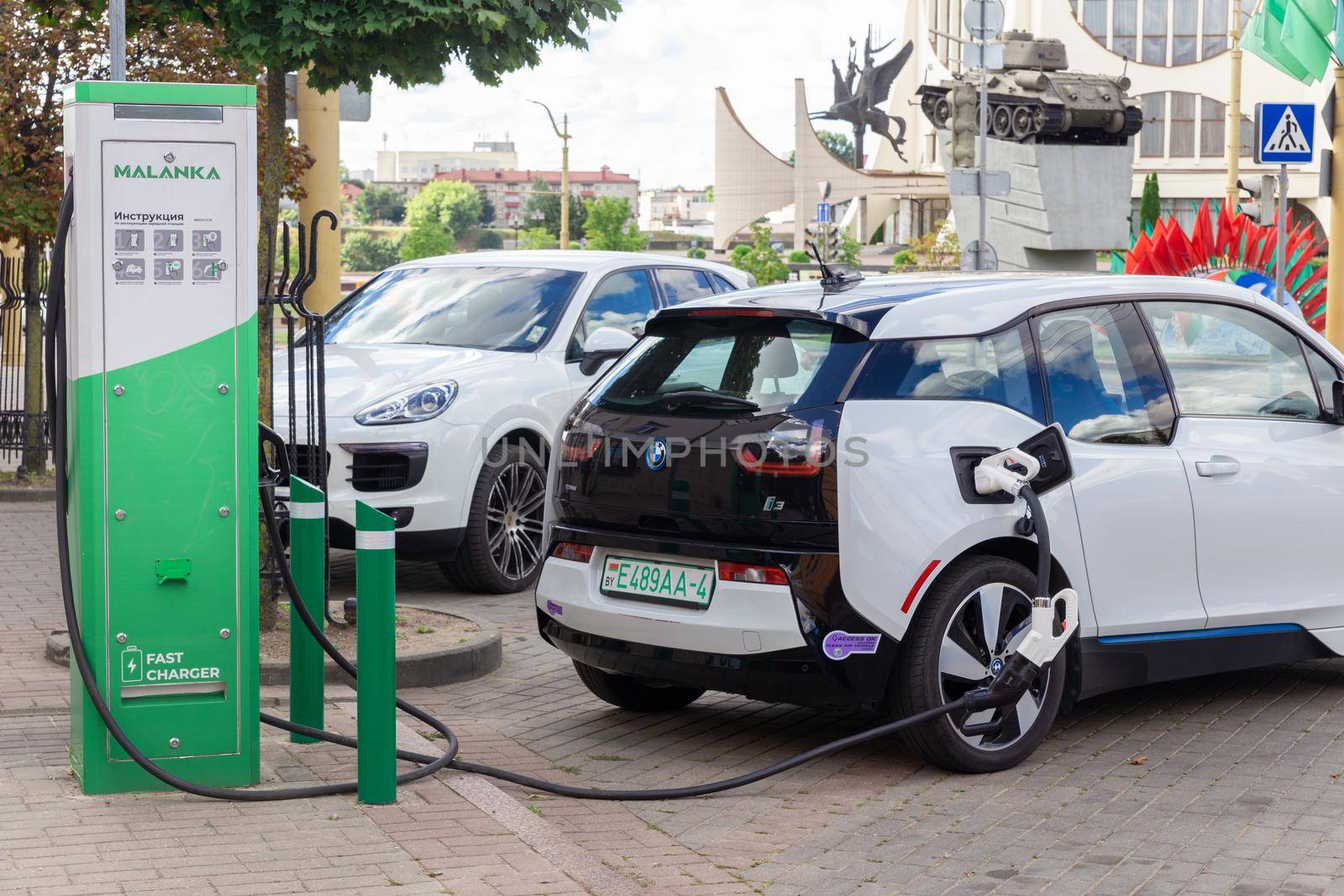 Grodno, Belarus - September 09, 2022: BMW i3 on 50kW fast charging spot Malanka on Soviet square - Car sharing commuter charging station. Charging technology industry transport which are the futuristic of the Automobile.