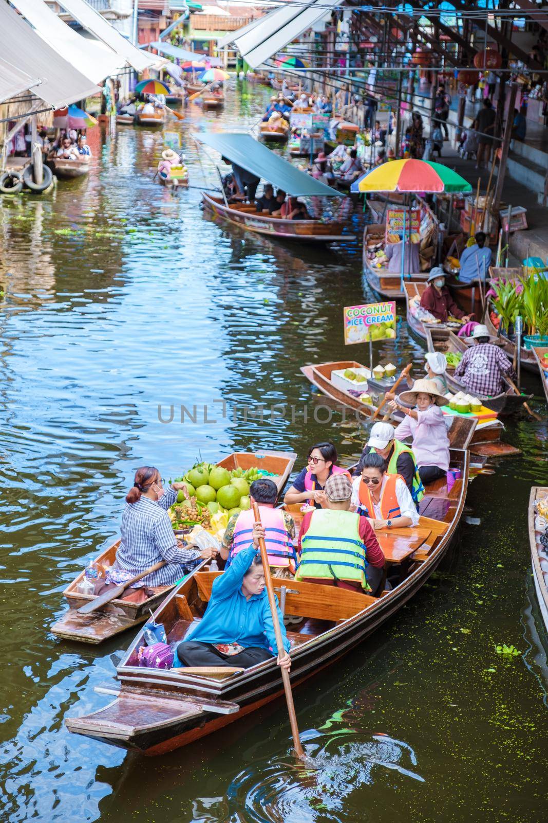 People at Damnoen saduak floating market, Bangkok Thailand. colorful floating market in Thailand