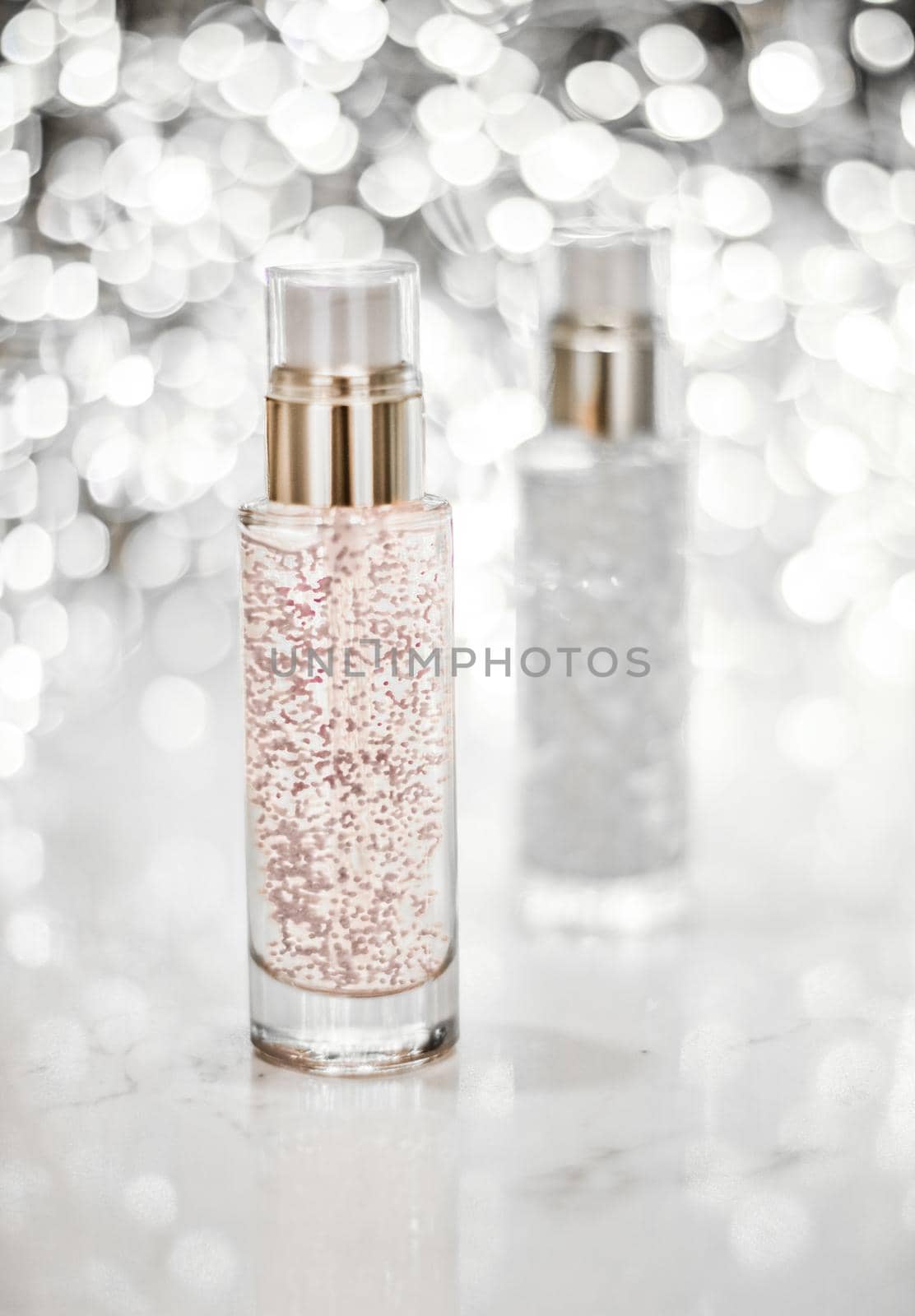 Holiday make-up base gel, serum emulsion, lotion bottle and silver glitter, luxury skin and body care cosmetics for beauty brand ads by Anneleven