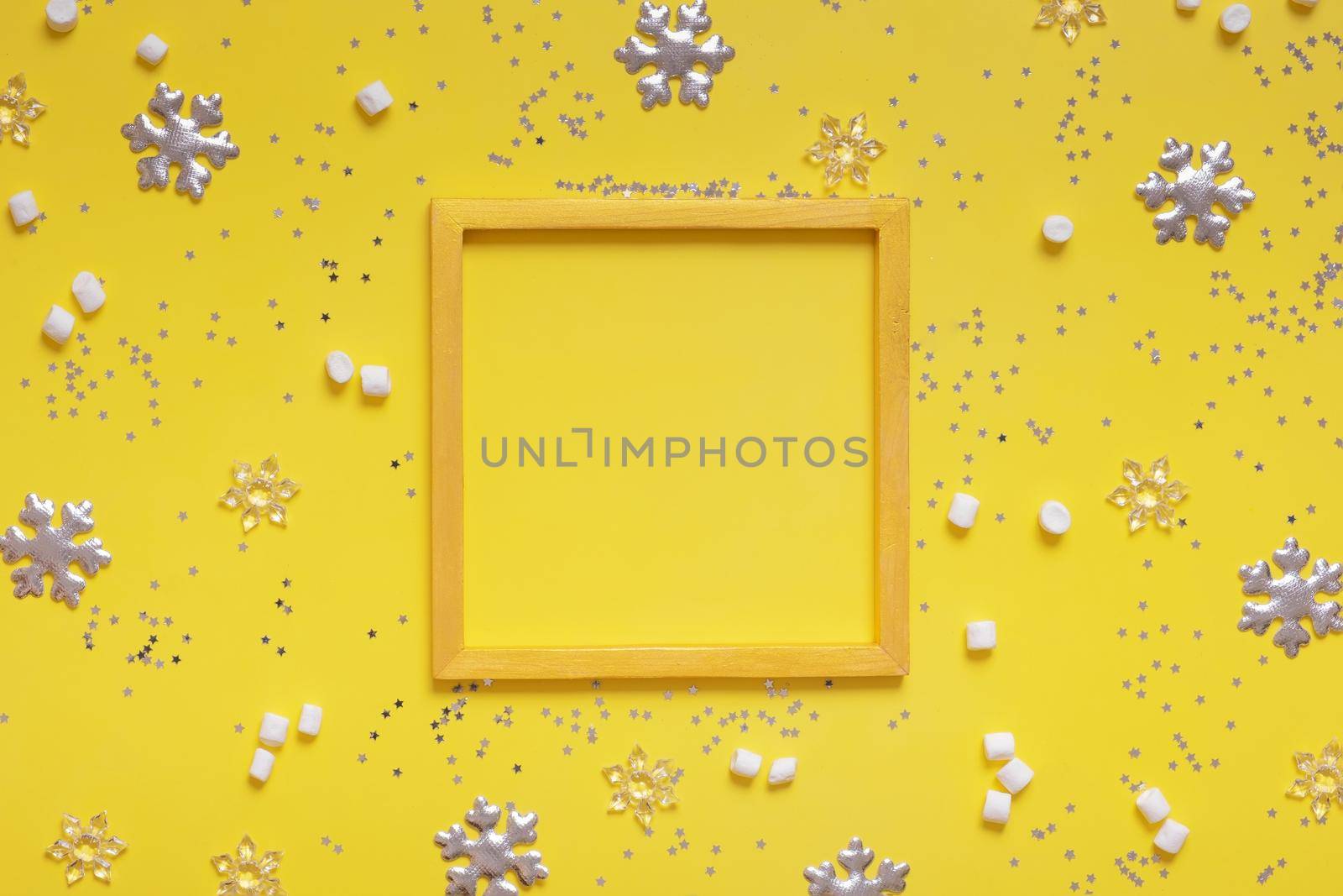 Christmas winter decoraton and golden frame for text on colored background.