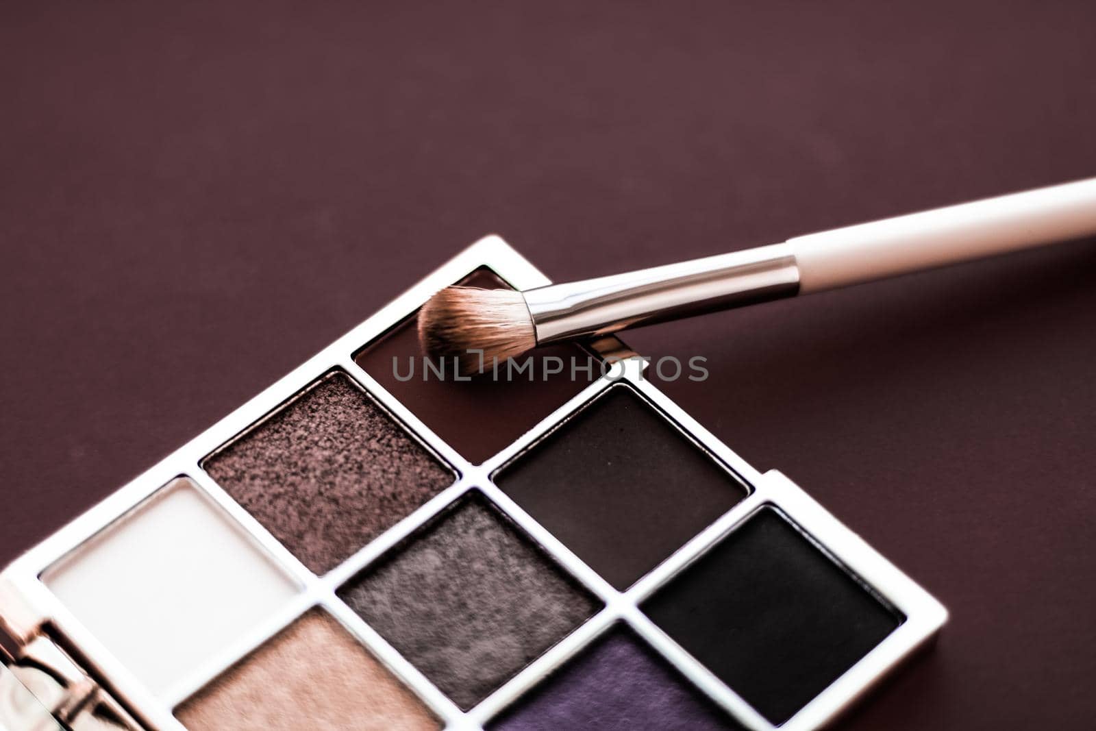 Cosmetic branding, mua and girly concept - Eyeshadow palette and make-up brush on chocolate background, eye shadows cosmetics product for luxury beauty brand promotion and holiday fashion blog design