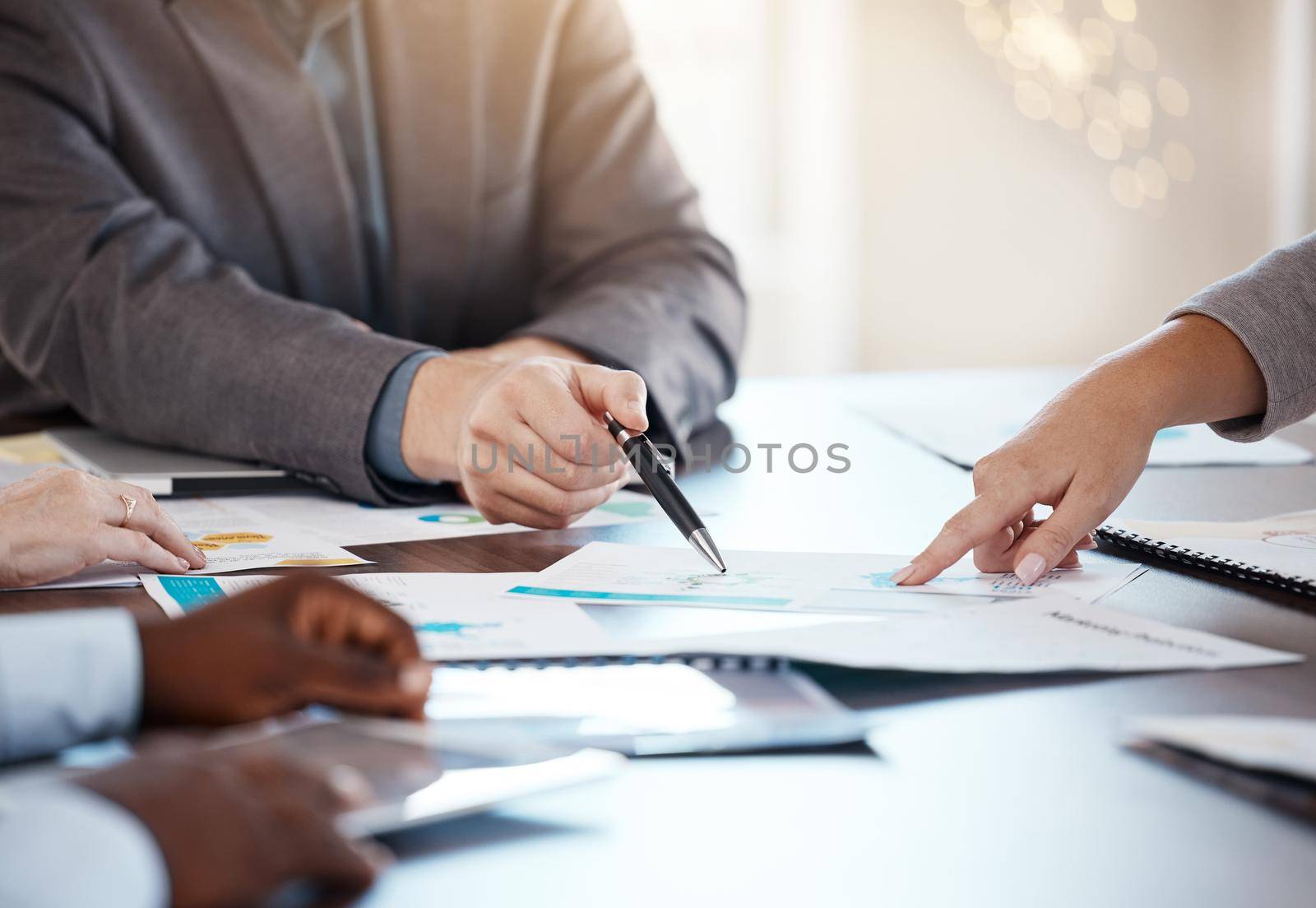 Corporate table, documents and hands in conversation on business analytics data report in office. Company workforce logistics, planning and strategy idea with professional communication