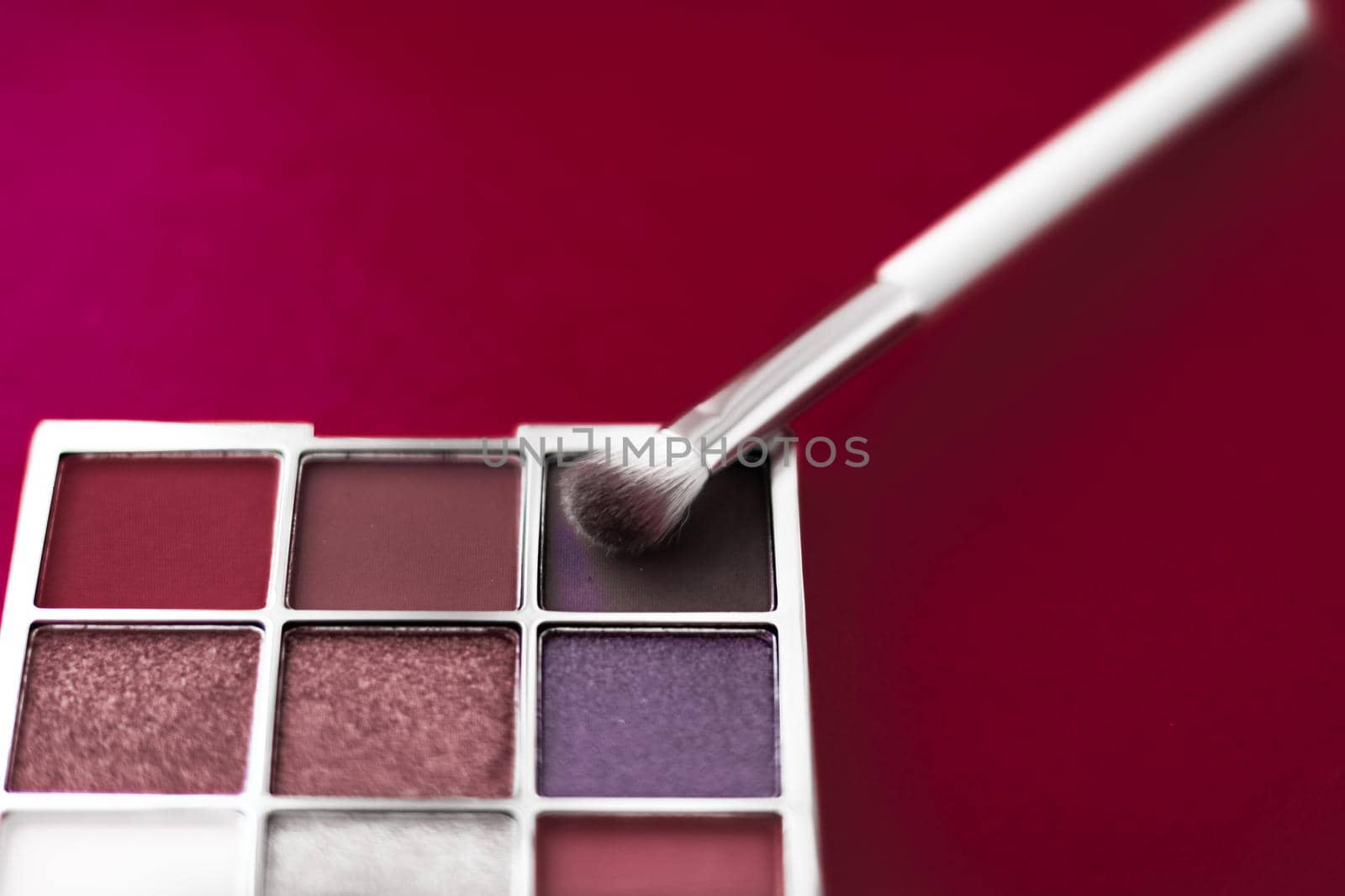 Cosmetic branding, mua and girly concept - Eyeshadow palette and make-up brush on cherry background, eye shadows cosmetics product for luxury beauty brand promotion and holiday fashion blog design