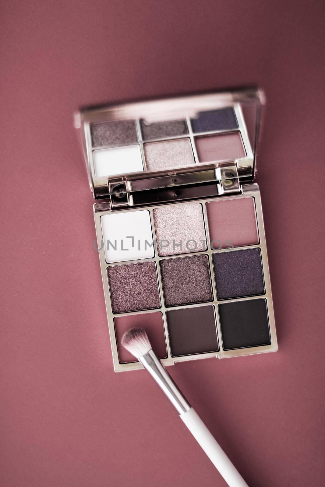 Cosmetic branding, mua and girly concept - Eyeshadow palette and make-up brush on rouge background, eye shadows cosmetics product for luxury beauty brand promotion and holiday fashion blog design