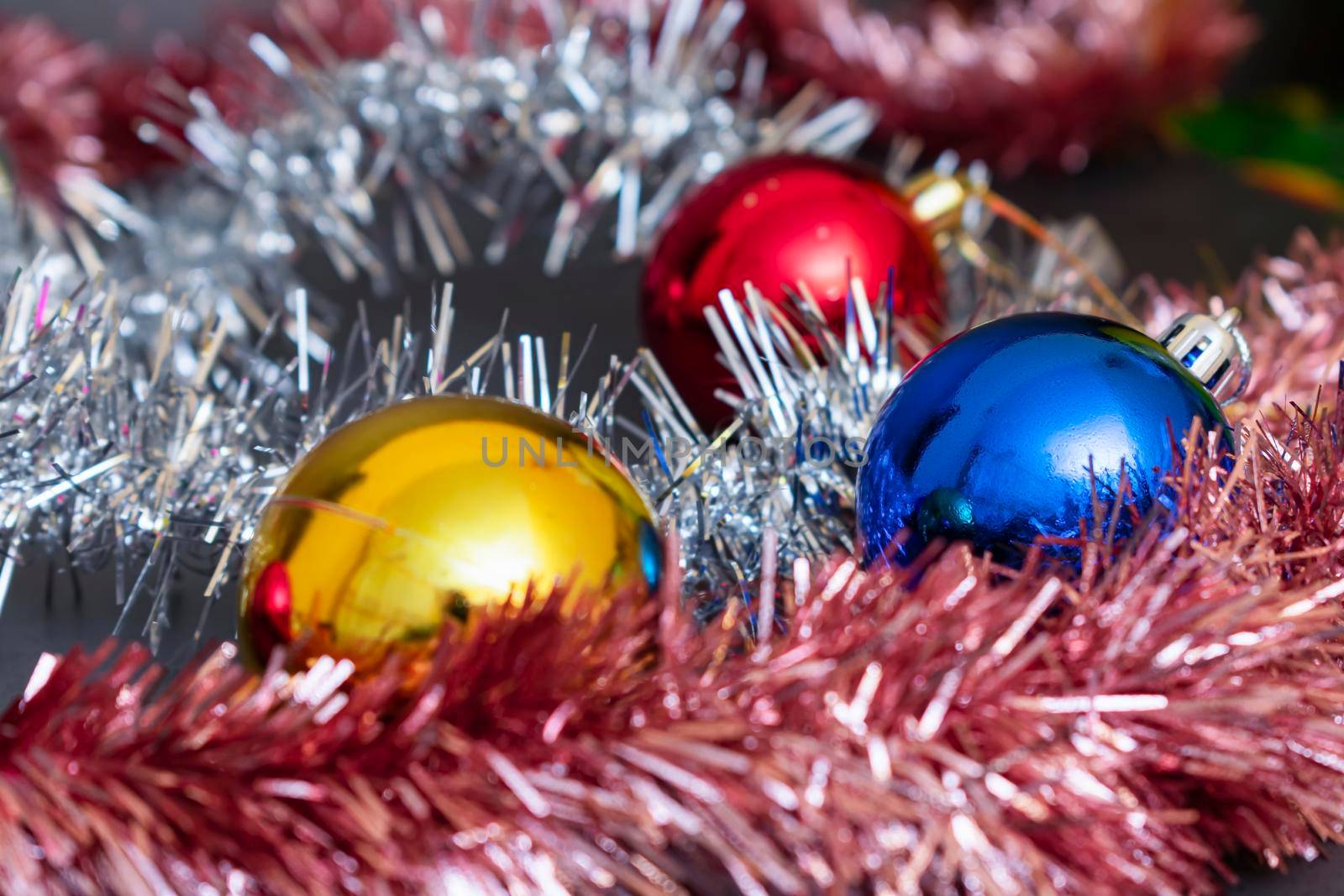 Festive decorations on the Christmas tree and New Year's tinsel