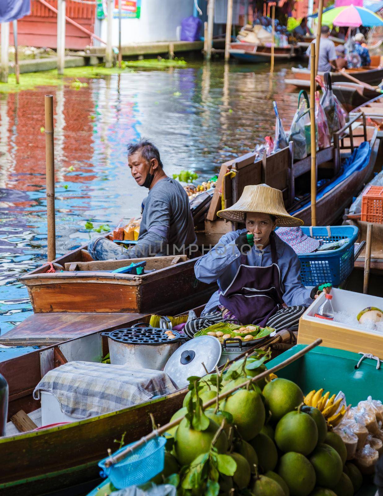 People at Damnoen saduak floating market, Bangkok Thailand. colorful floating market in Thailand