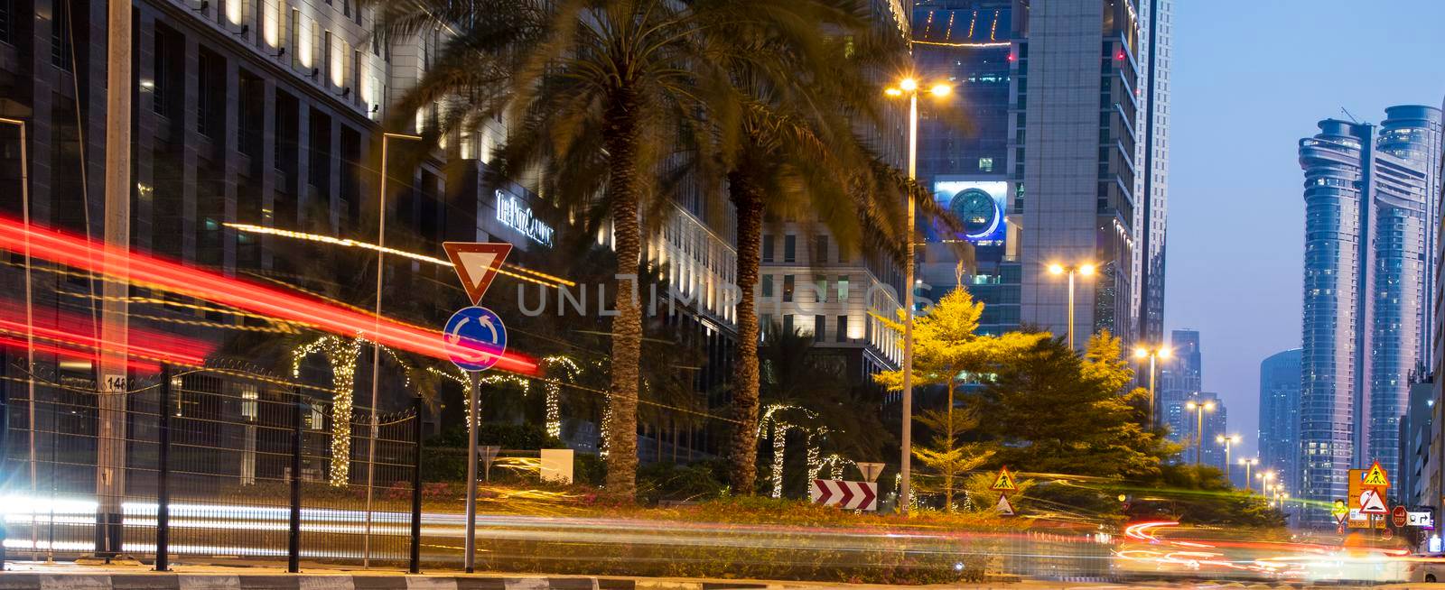 Light trails on Dubai Financial Center road. Dubai. by pazemin