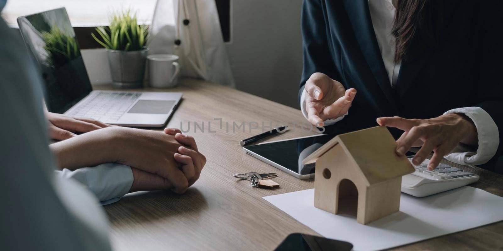 buy or sell real estate concept, Sale representative offer house purchase contract to buy a house or apartment and give home key chain to customer.