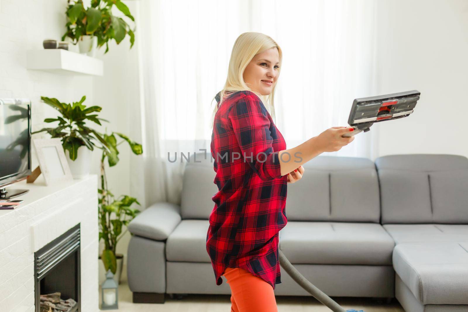 woman cleans the floor of the house