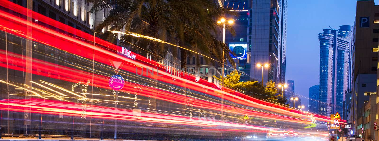 Light trails on Dubai Financial Center road. Address Sky view and Ritz Carlton hotel can be seen in the picture by pazemin